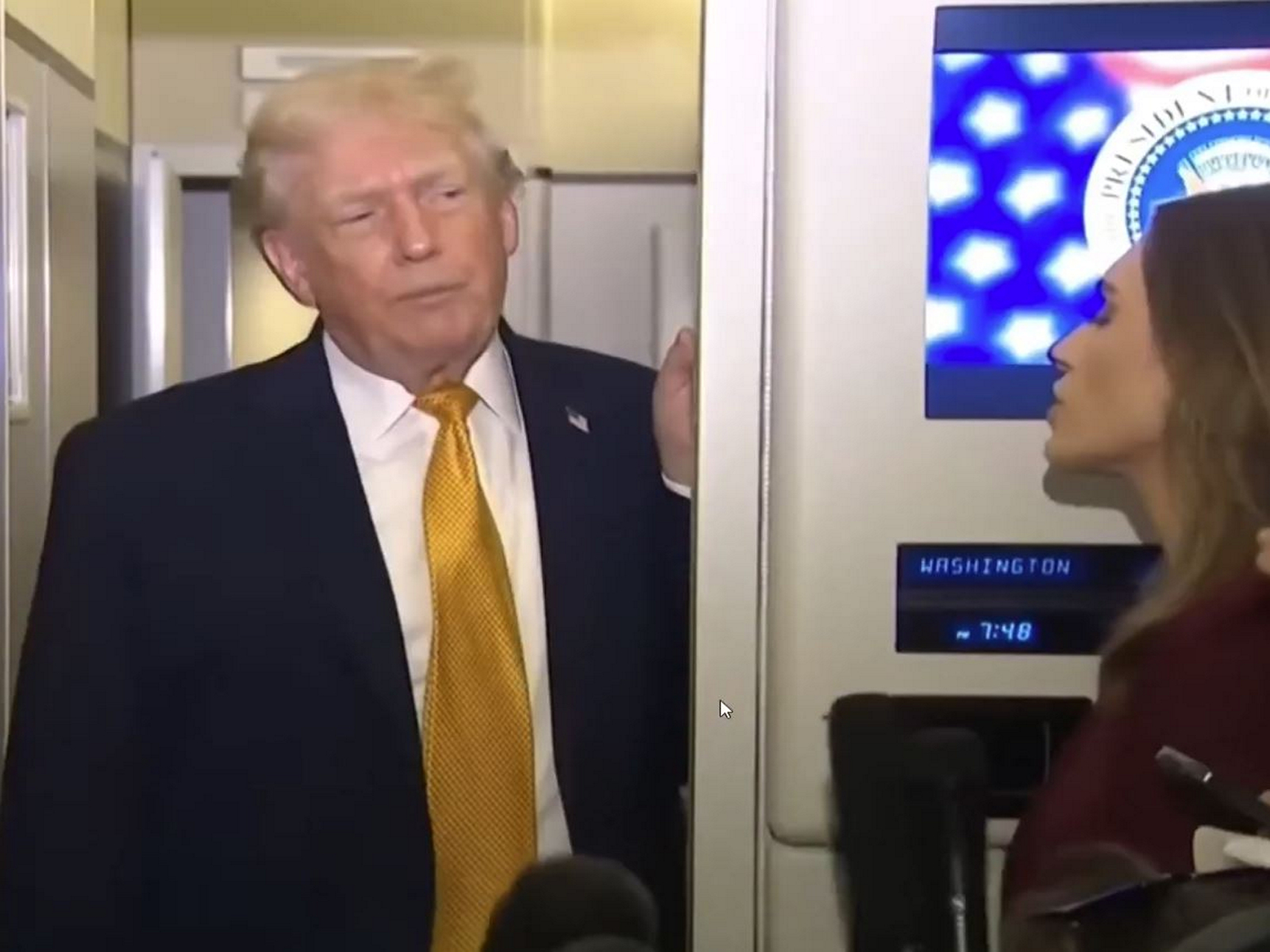 U.S. President Donald Trump speaks to reporters aboard Air Force One en route from Florida to Joint Base Andrews (Photo/US Network Pool via Reuters)