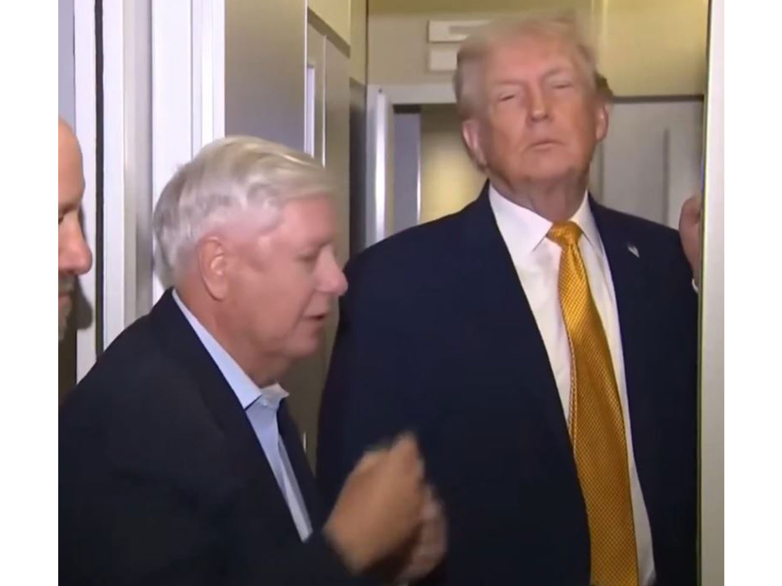 U.S. President Donald Trump speaks to reporters aboard Air Force One en route from Florida to Joint Base Andrews (Photo/US Network Pool via Reuters)