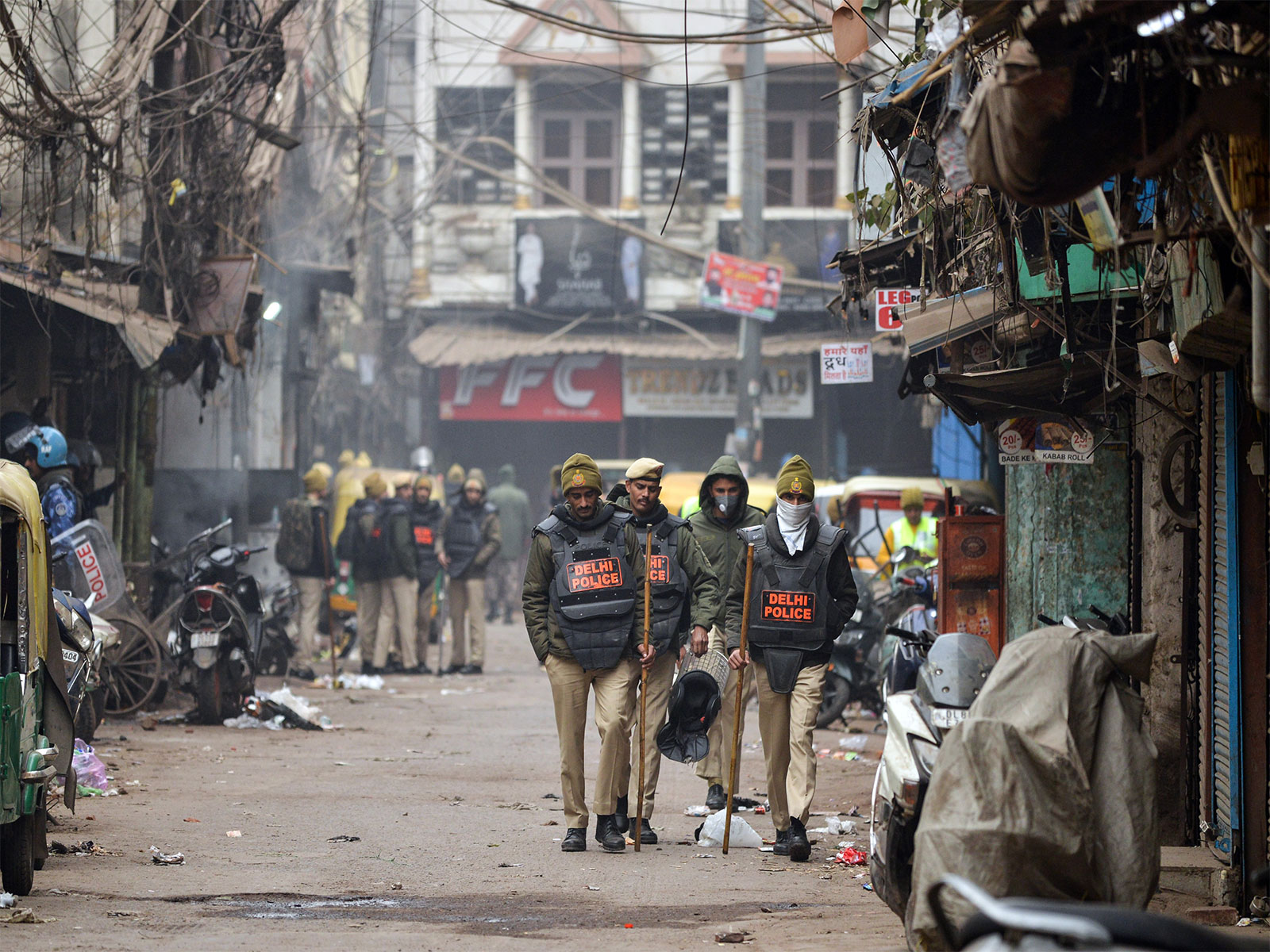Delhi Police personnel walking at the Turkman Gate area where a demolition drive was carried out (Photo/ANI)