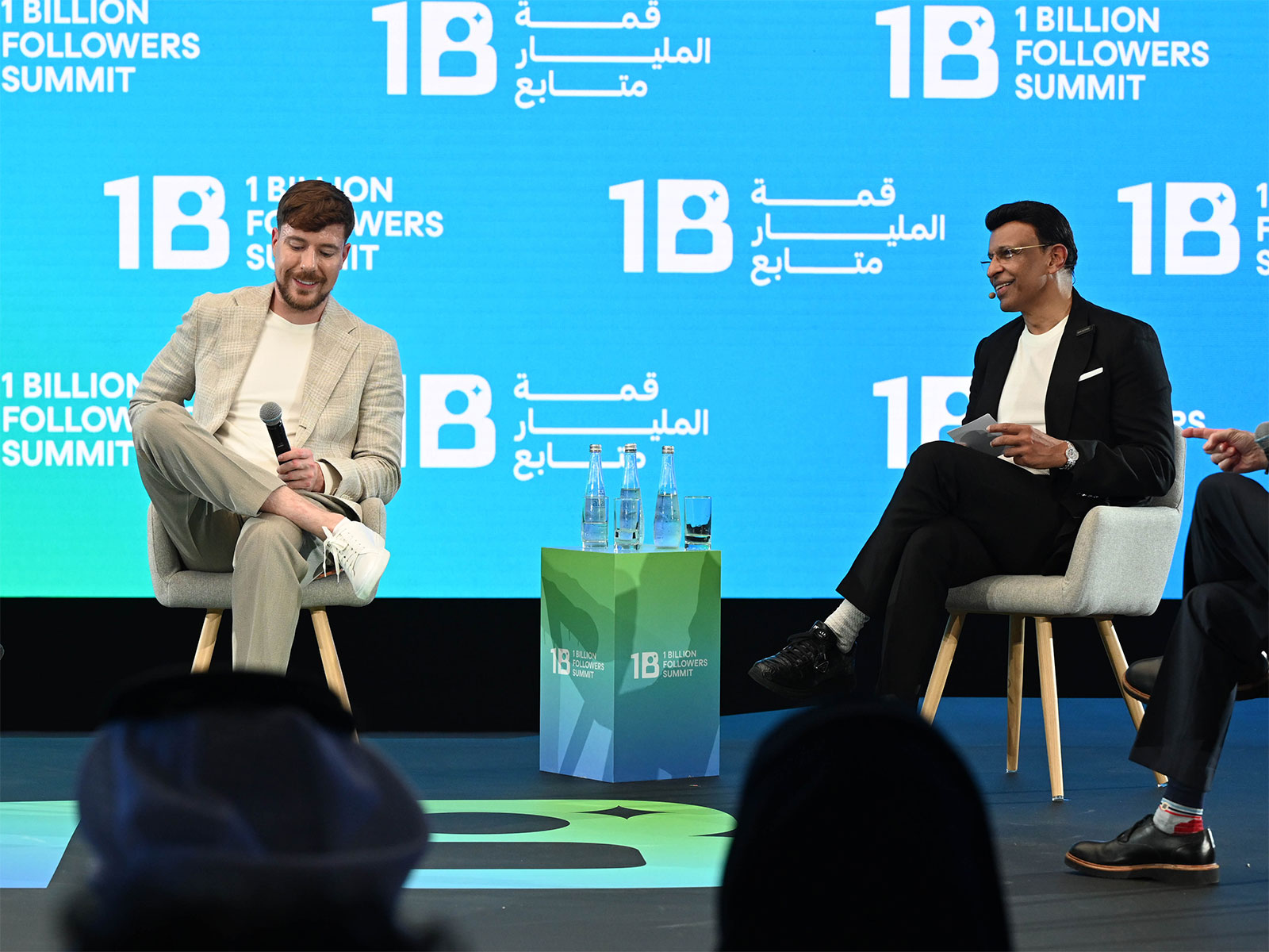MrBeast and Sunny Varkey speaking onstage at the 1 Billion Follower Summit in Dubai