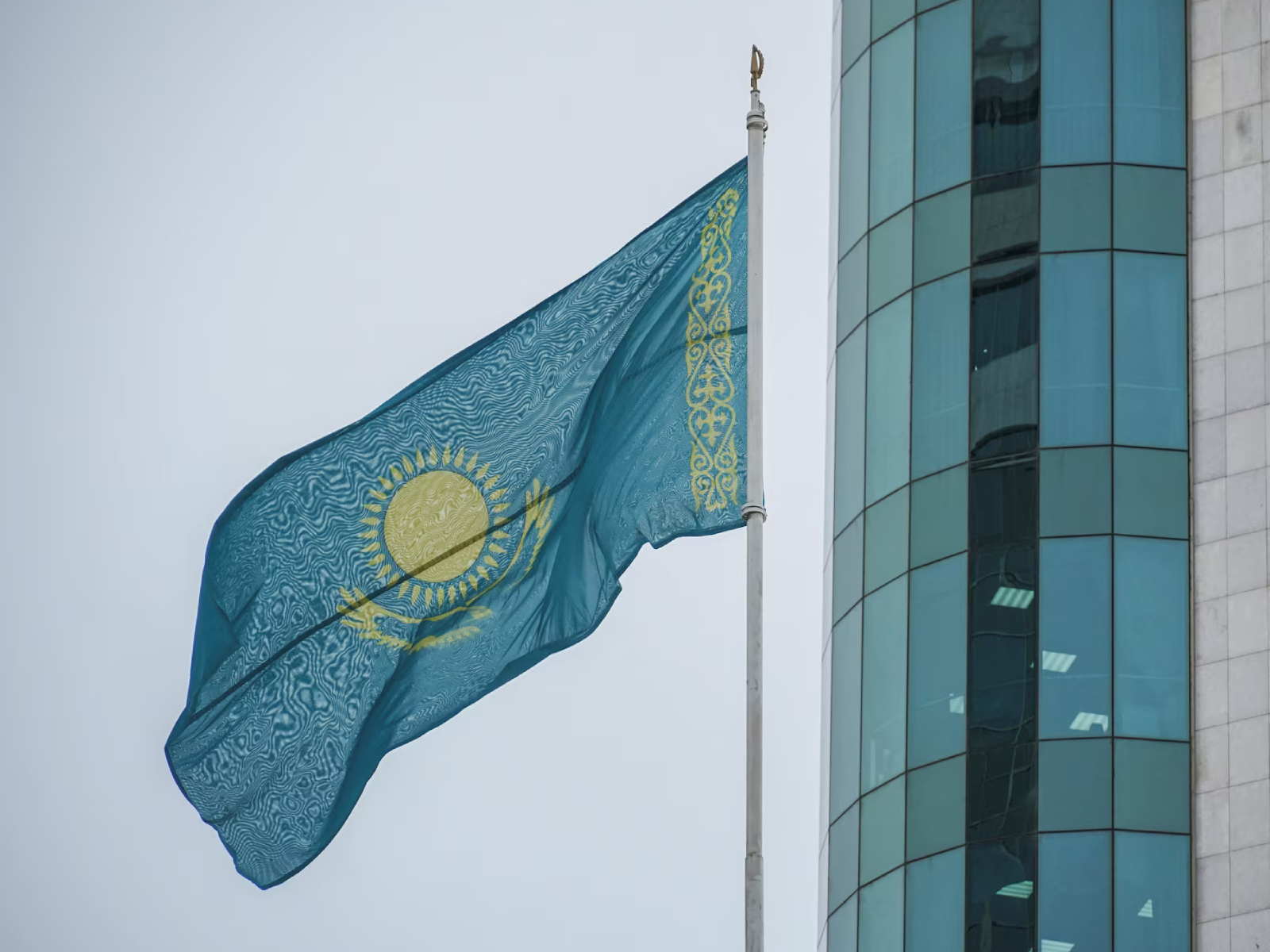 Kazakhstan's national flag flies outside the Mazhilis, the lower house of Parliament, in Astana, Kazakhstan. (Photo/Reuters)