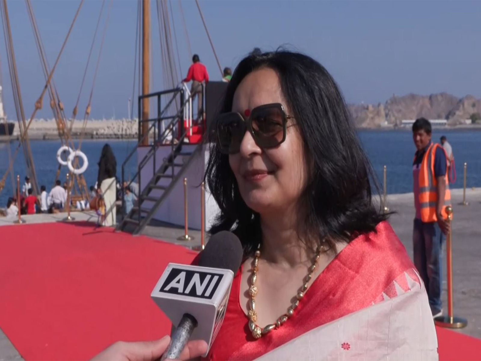 Smita Barooah, wife of INSV Kaundinya crew member and Prime Minister's Economic Advisory Council member Sanjeev Sanyal, reacts as the stitched sailing vessel completes its maiden voyage and arrives in Muscat. (Photo/ANI)