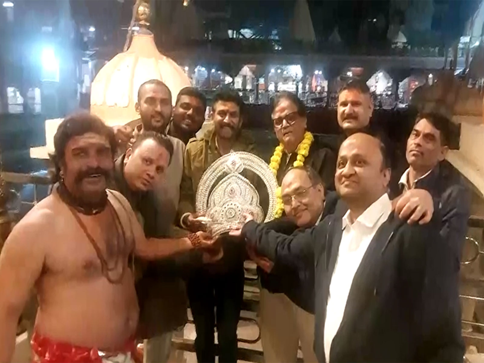 Devotee Pradeep Gupta and his team with the crown (Photo/ANI)