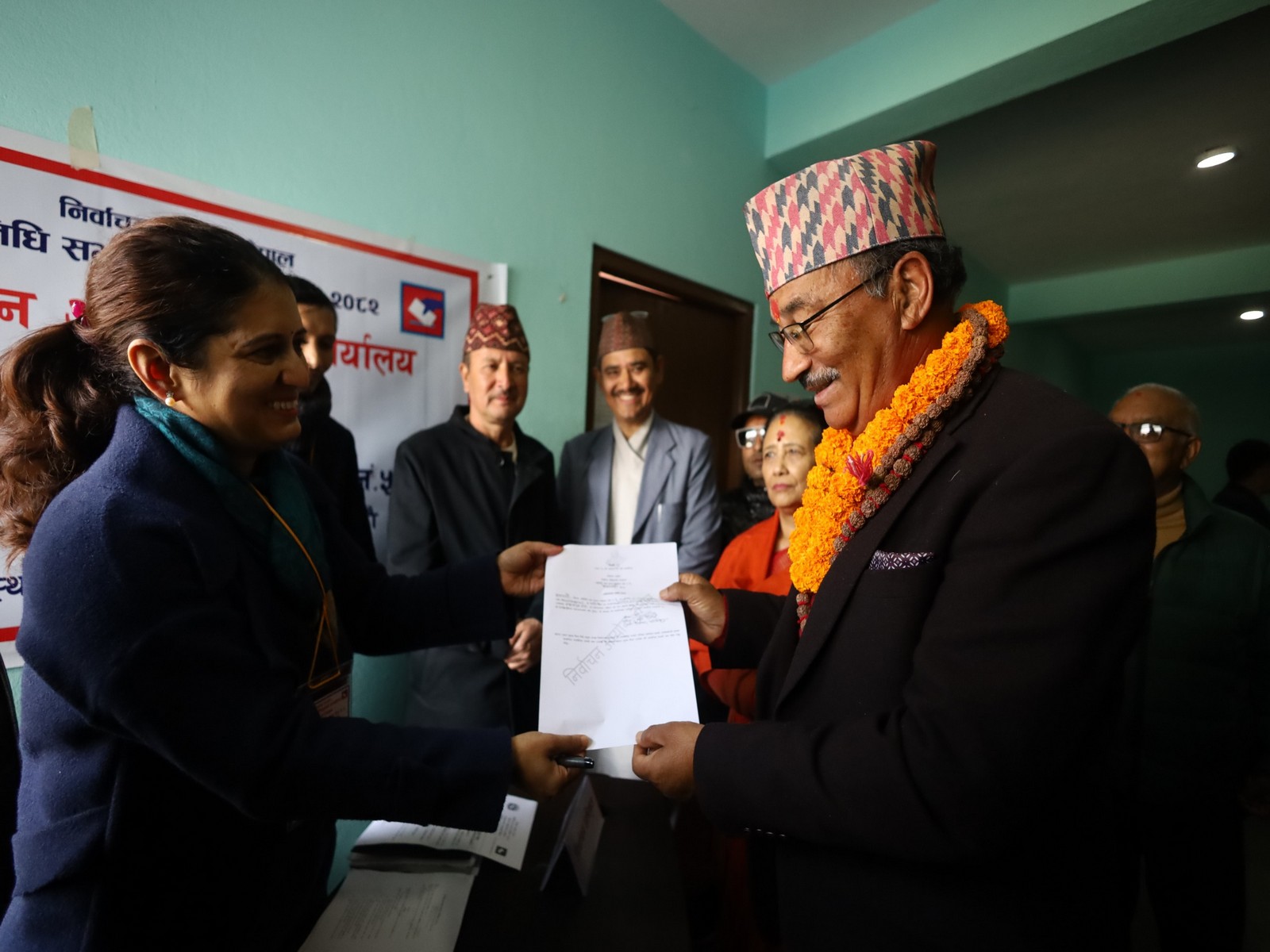 Kamal Thapa from right-wing Rastriya Prajatantra Party (RPP) receives his certificate of registration from election officer (Photo/ANI)
