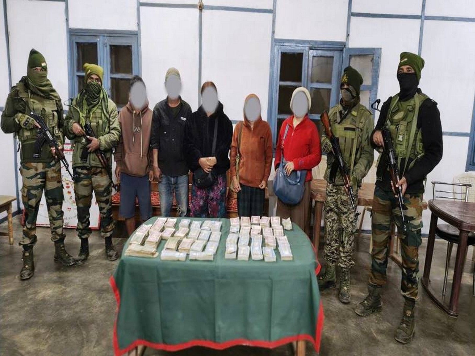 Assam Rifles team with recovered contraband and apprehended individuals (Photo/Assam Rifles)
