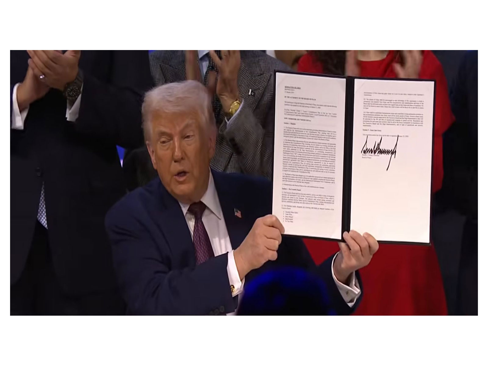 US President Donald Trump signs the charter to formally launch the "Board of Peace" initiative at the World Economic Forum in Davos, Switzerland. (Image Source: The White House/YouTube)
