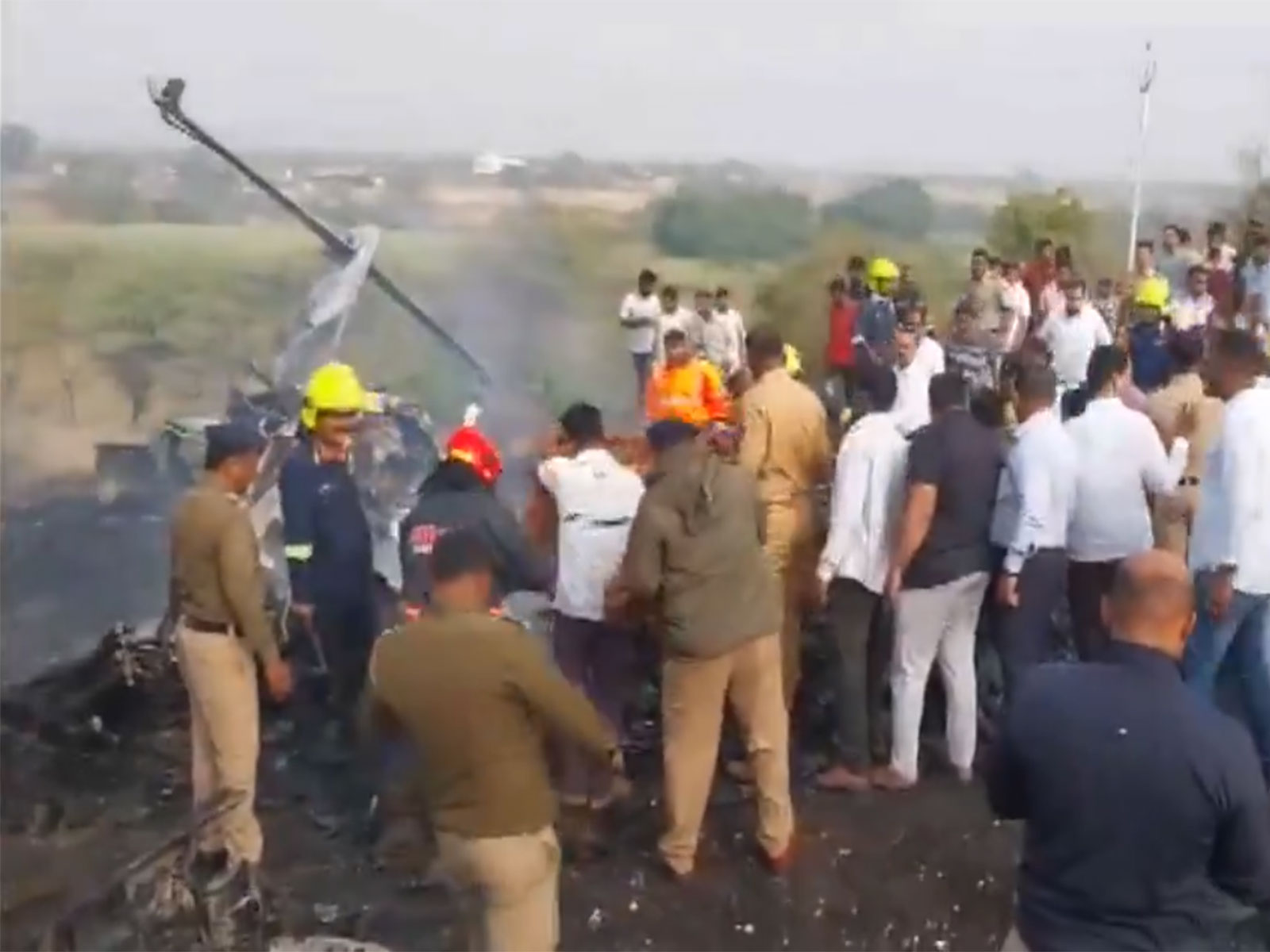  Visuals from the crash spot show fire and smoke spewing from the remains of the plane near Baramati airport in Maharashtra. (Photo/ANI)