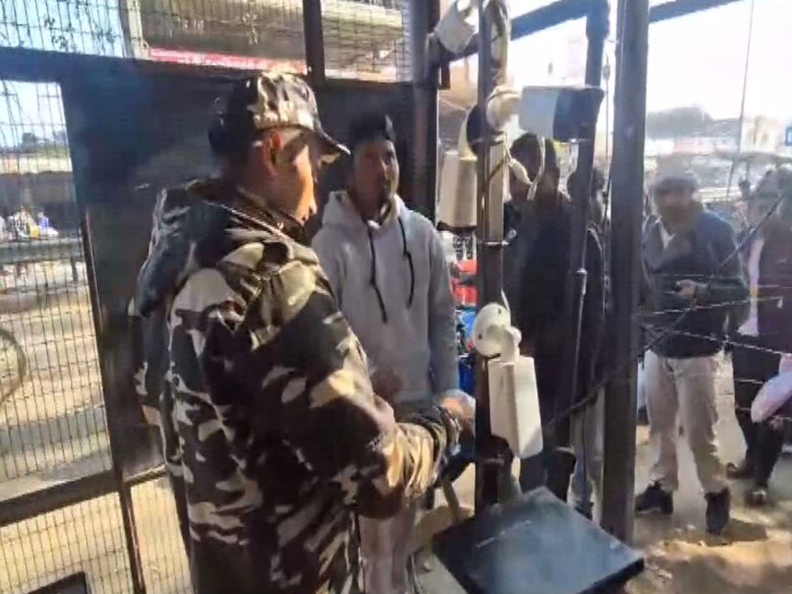 An SSB personnel performing frisking and checking at the Rupaidiha checkpost along the India-Nepal border in Uttar Pradesh's Bahraich. (Photo/ANI)