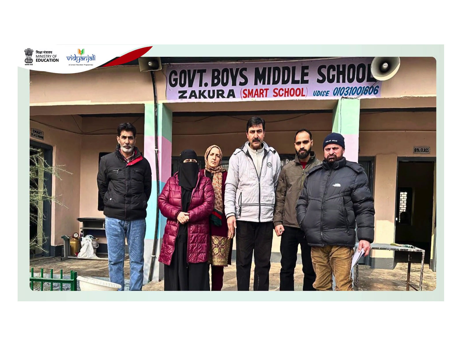 Teachers and volunteers pose outside Govt Boys Middle School, Zakura (Smart School), in Srinagar district, Jammu and Kashmir, as part of Vidyanjali-supported efforts to strengthen government schools through infrastructure upgrades and digital learnin