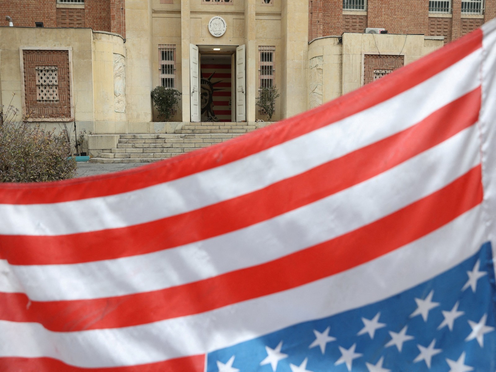 An upside-down U.S flag flutters at the former United States Embassy in Tehran, Iran (Photo/Reuters)