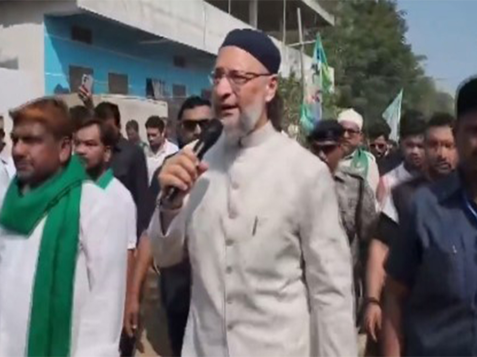 AIMIM Chief Owaisi holds door-to-door election canvassing ahead of Telangana municipal polls. (Photo/ANI)