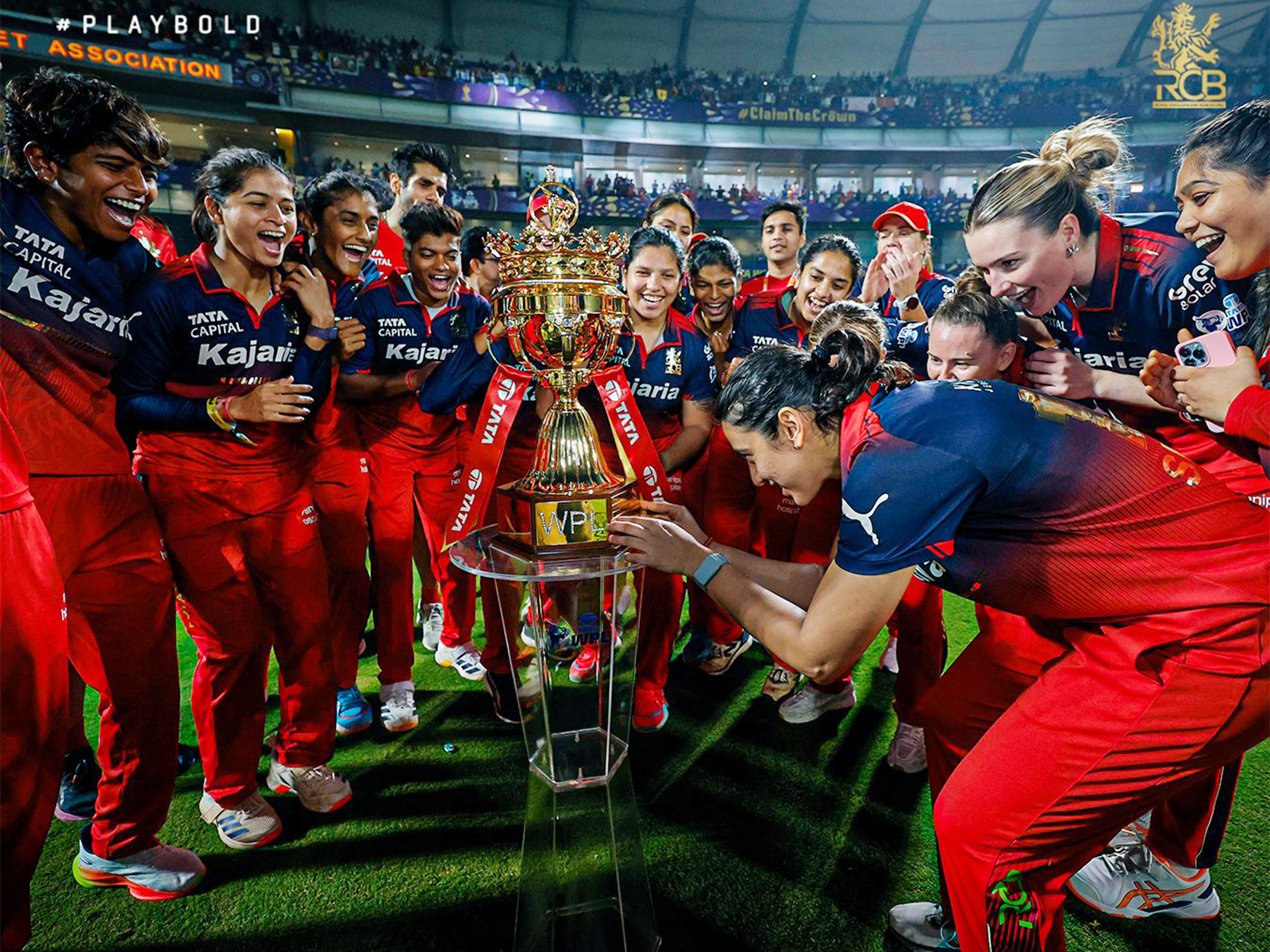 RCB team celebrating with the title. (Photo: @RCBTweets X)