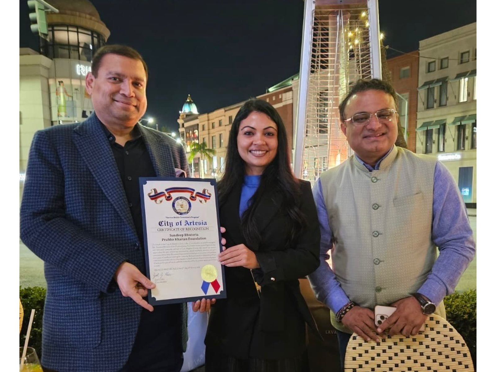 Zeel Ahir, Council Member, City of Artesia, in presence of K J Srinivasa, Consul General India, Los Angeles, presenting Certificate of Recognition to Sundeep Bhutoria