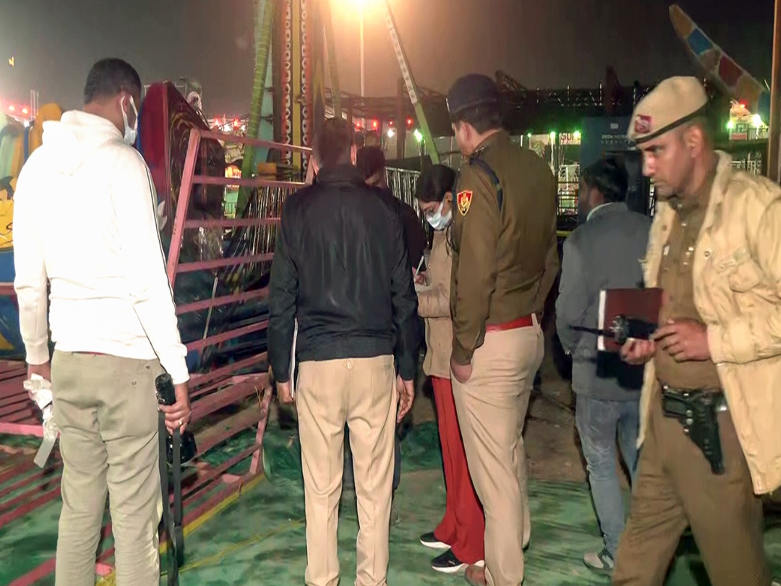 Police personnel examine site after a joyride swing collapsed in Faridabad. (Photo/ANI)