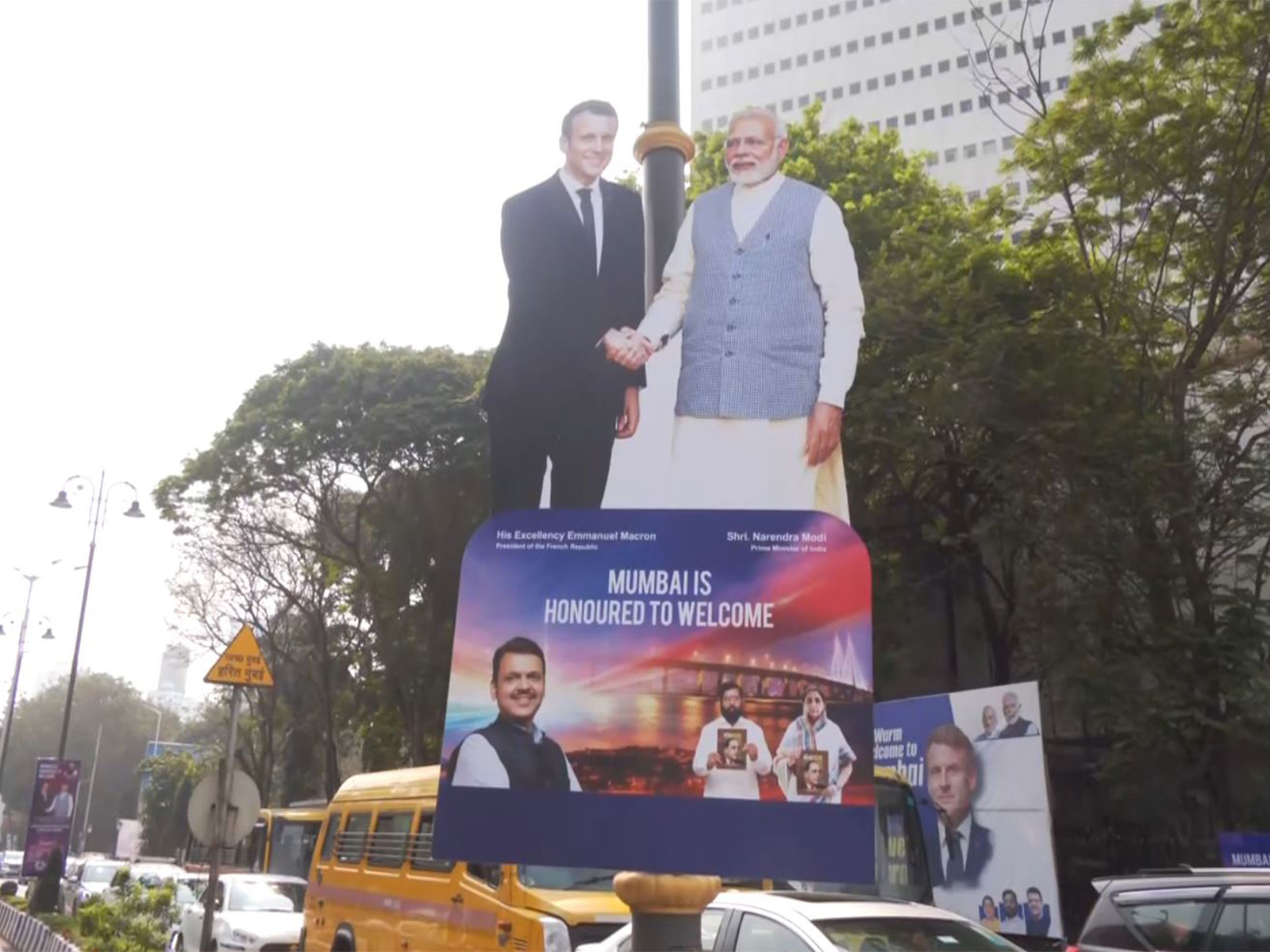 Posters and banners welcoming French President Emmanuel Macron and First Lady Brigitte Macron adorn the streets of Mumbai. (Photo/ANI)