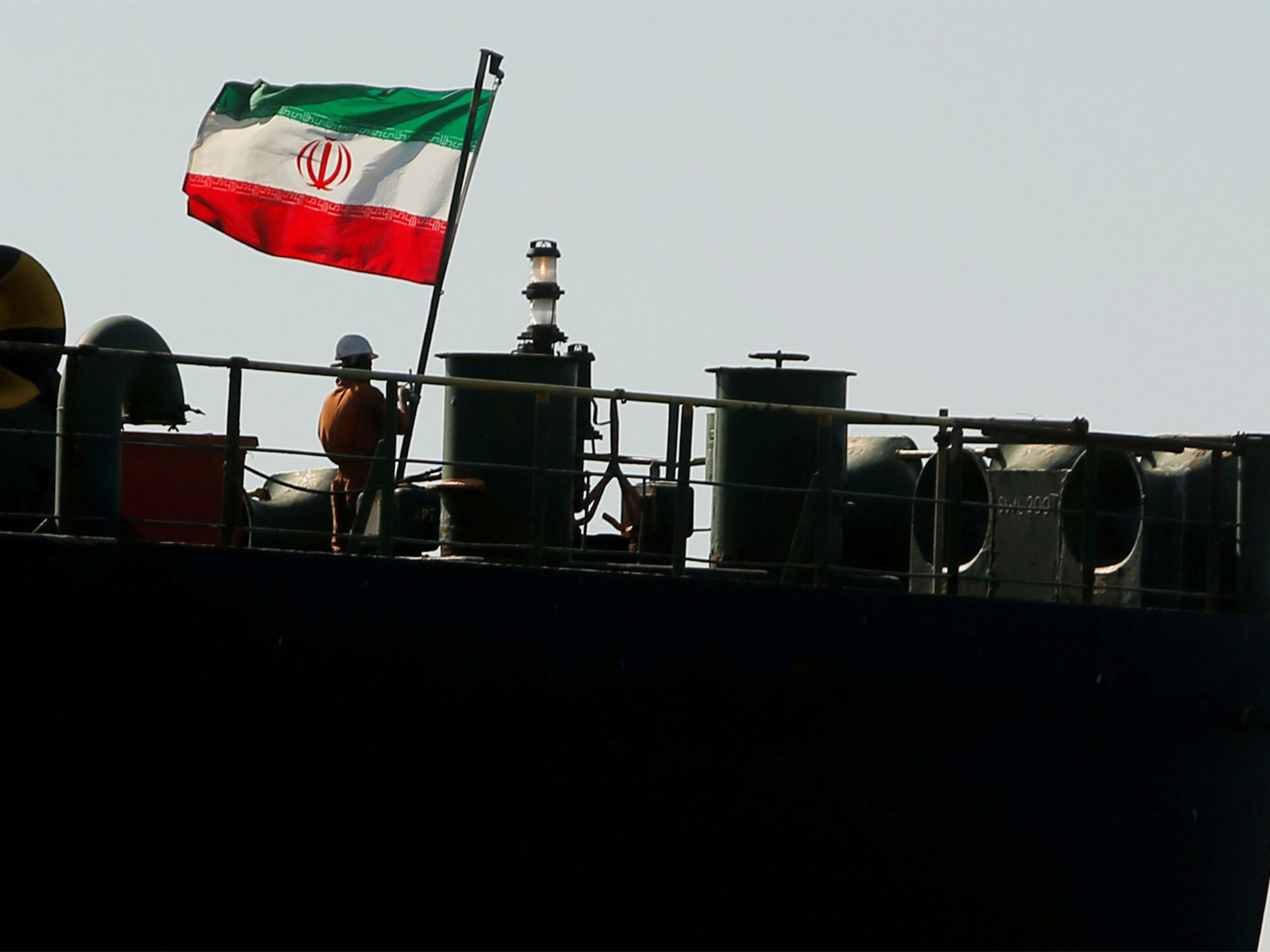 A crew member raises the Iranian flag on Iranian oil tanker (Representative File Photo/Reuters)