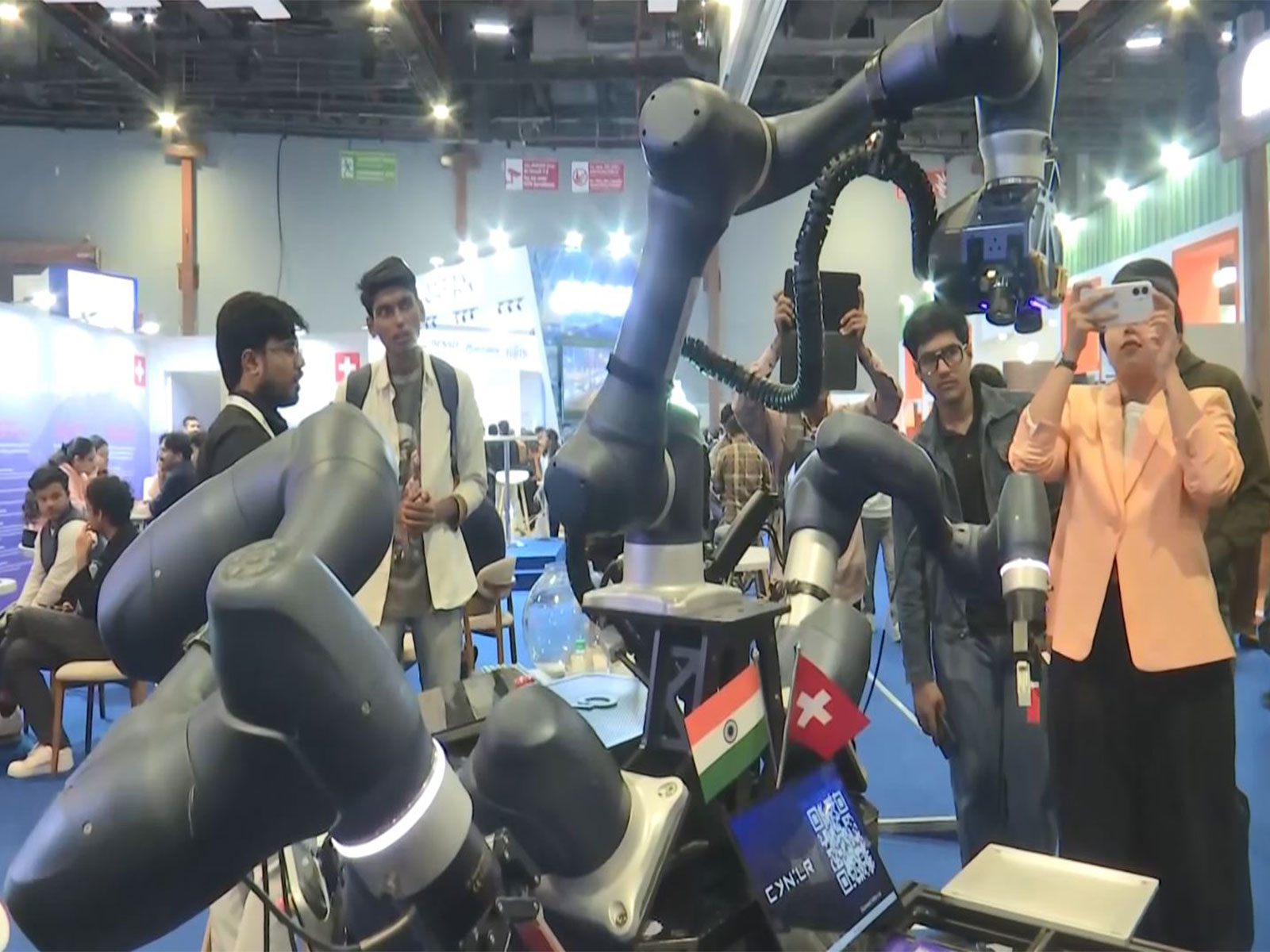 CyRo, the stationary robot developed by CynLr, demonstrates intuitive object handling at the AI Impact Summit pavilion in New Delhi. (Photo/ANI)
