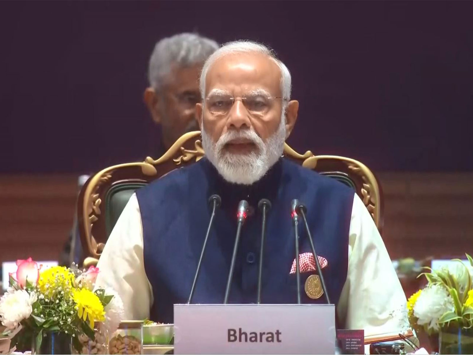 Prime Minister Narendra Modi addresses the Plenary Session of the India AI Impact Summit 2026 at Bharat Mandapam in New Delhi, emphasising human-centric and transparent AI development. (Photo/ANI)