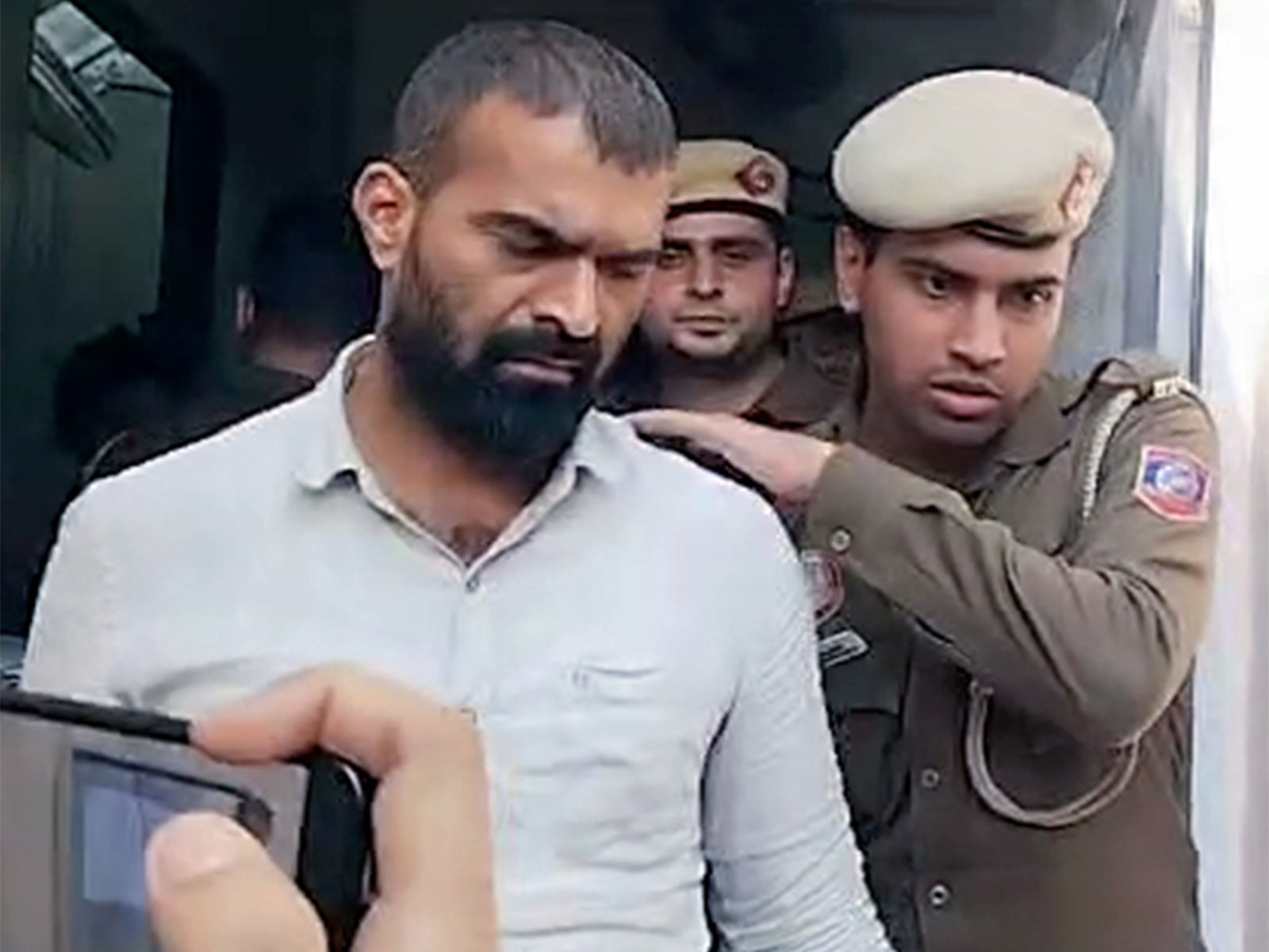 Indian Youth Congress workers brought to Patiala House Court by the police in connection with their protest at the AI   Summit at Bharat Mandapam (Photo/ANI)