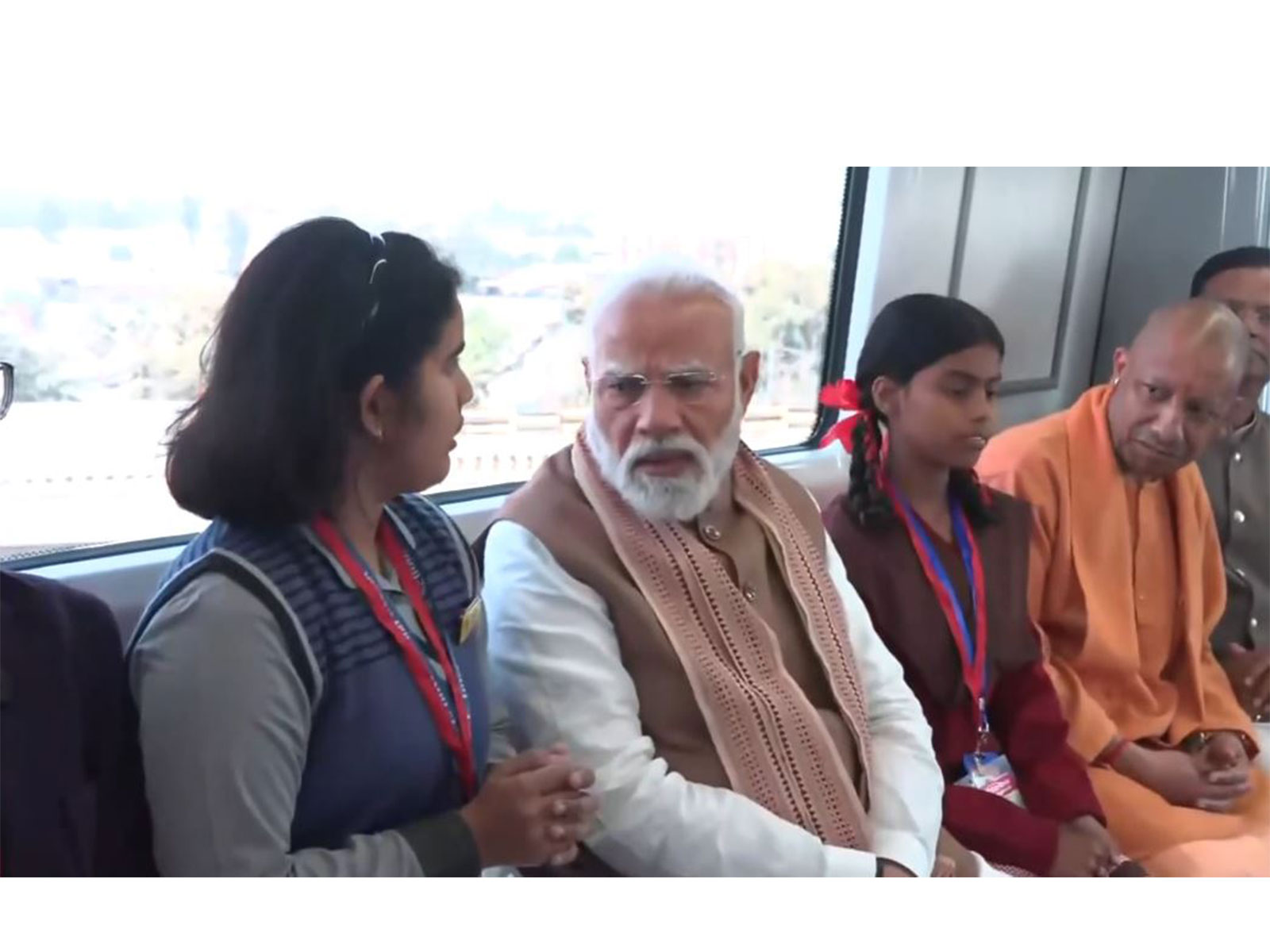 Prime Minister Narendra Modi interacting with students onboard metro (Photo/ANI)