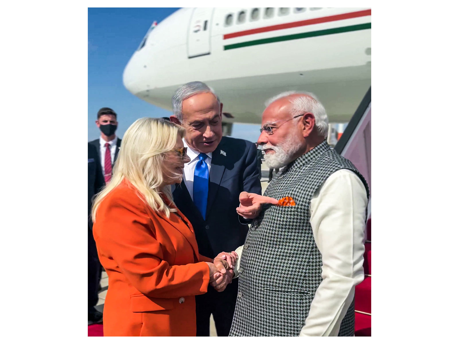 Israel PM Benjamin Netanyahu points to matching colour of his wife  Sara Netanyahu's outfit and PM Modi's pocket square (Photo/ANI)
