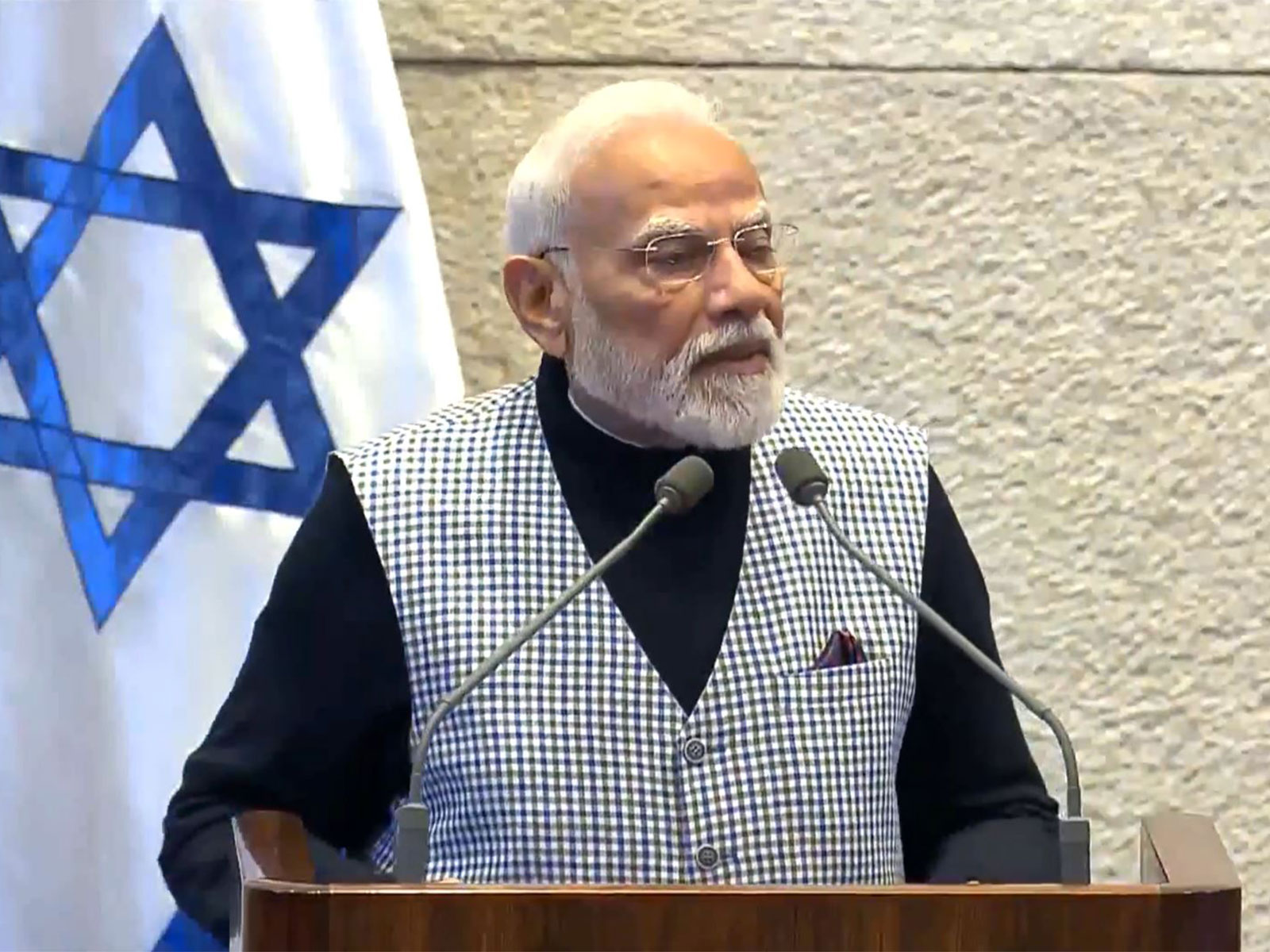Prime Minister Narendra Modi addresses the Knesset in Jerusalem, highlighting technology cooperation, innovation synergies, and the strengthening India-Israel partnership. (Image Source: DD News)