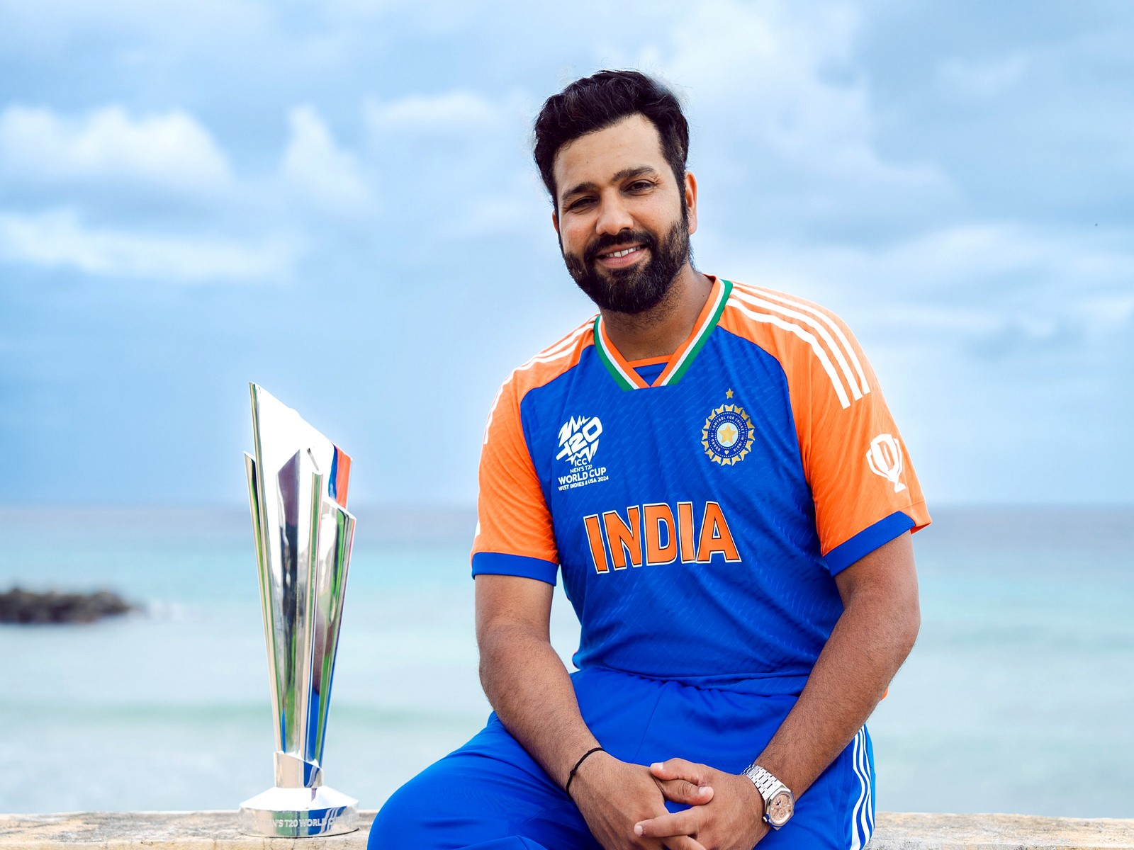India captain Rohit Sharma with the ICC Mens T20 World Cup 2024 trophy. (Photo/ANI) 