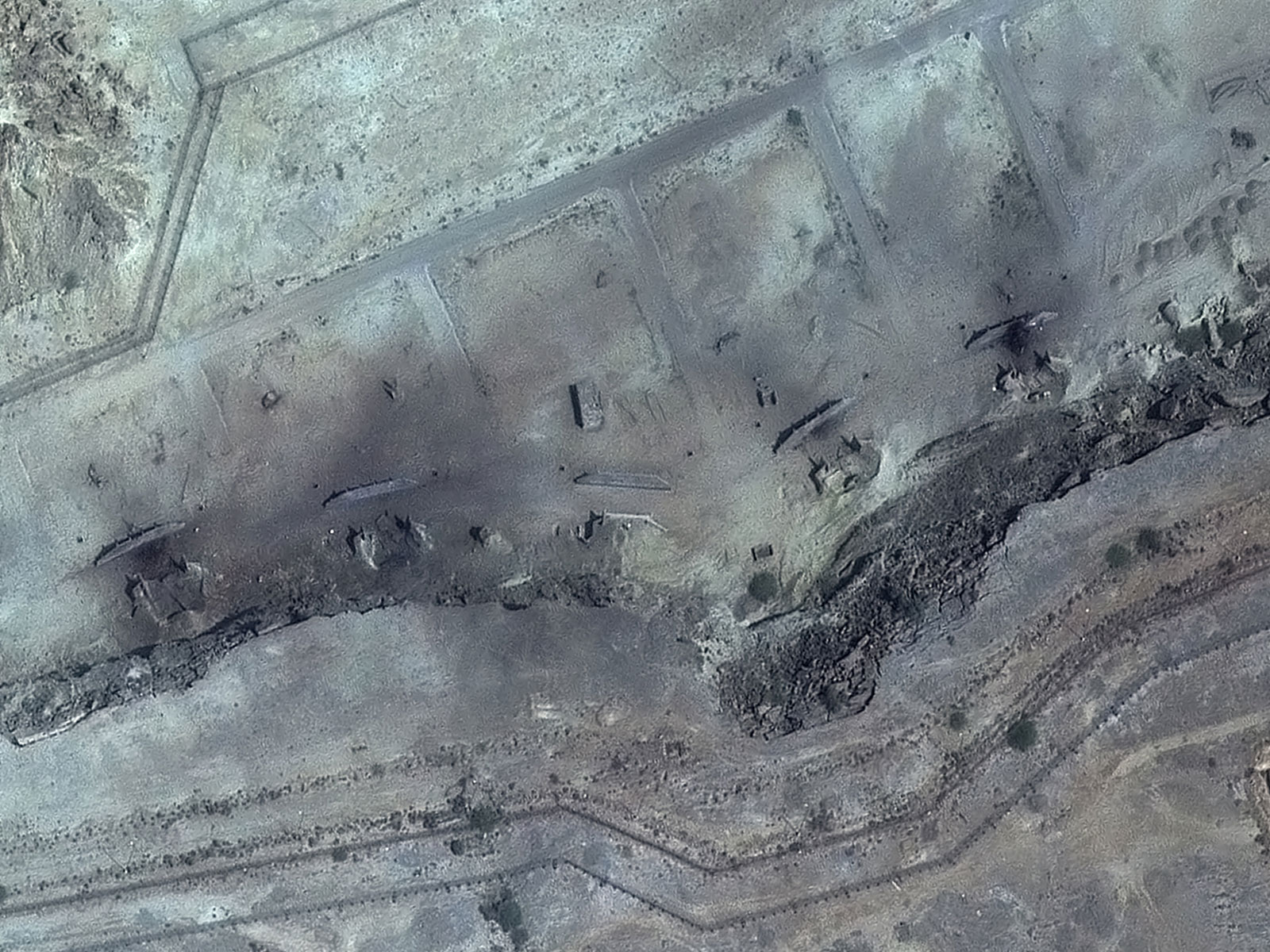 A satellite view shows destroyed storage bunkers after US and Israeli strikes, at Konarak, Iran (Photo/Reuters)