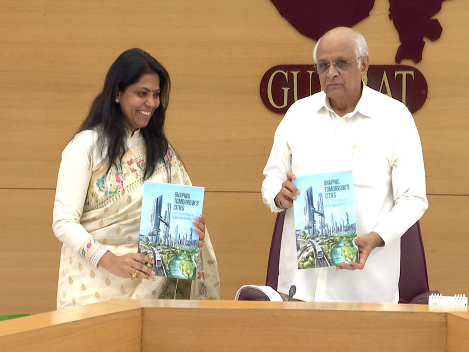 Gujarat CM Patel releases the book "Shaping Tomorrow's Cities -From Climate Risk to Green Opportunities" (Photo/Gujarat CMO)