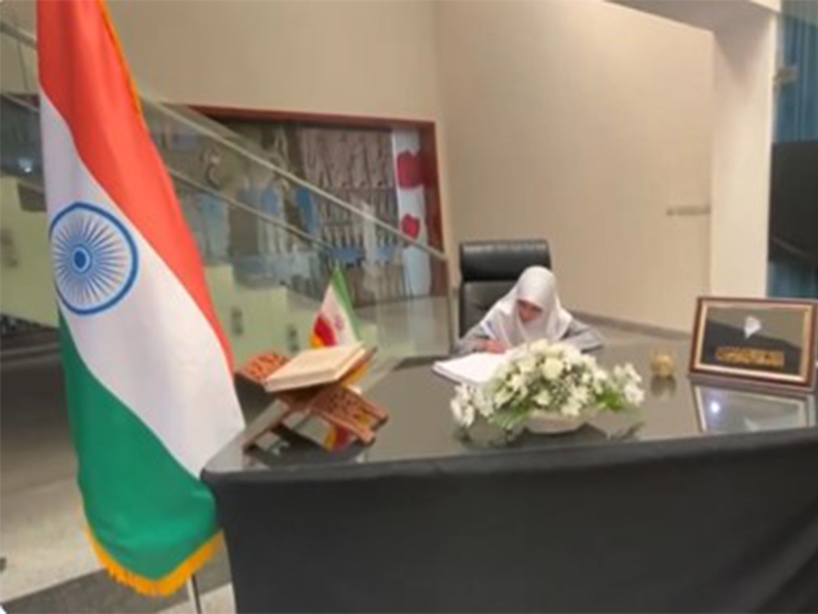 Visual of visitor signing a Condolence Book in Hyderabad (ANI)