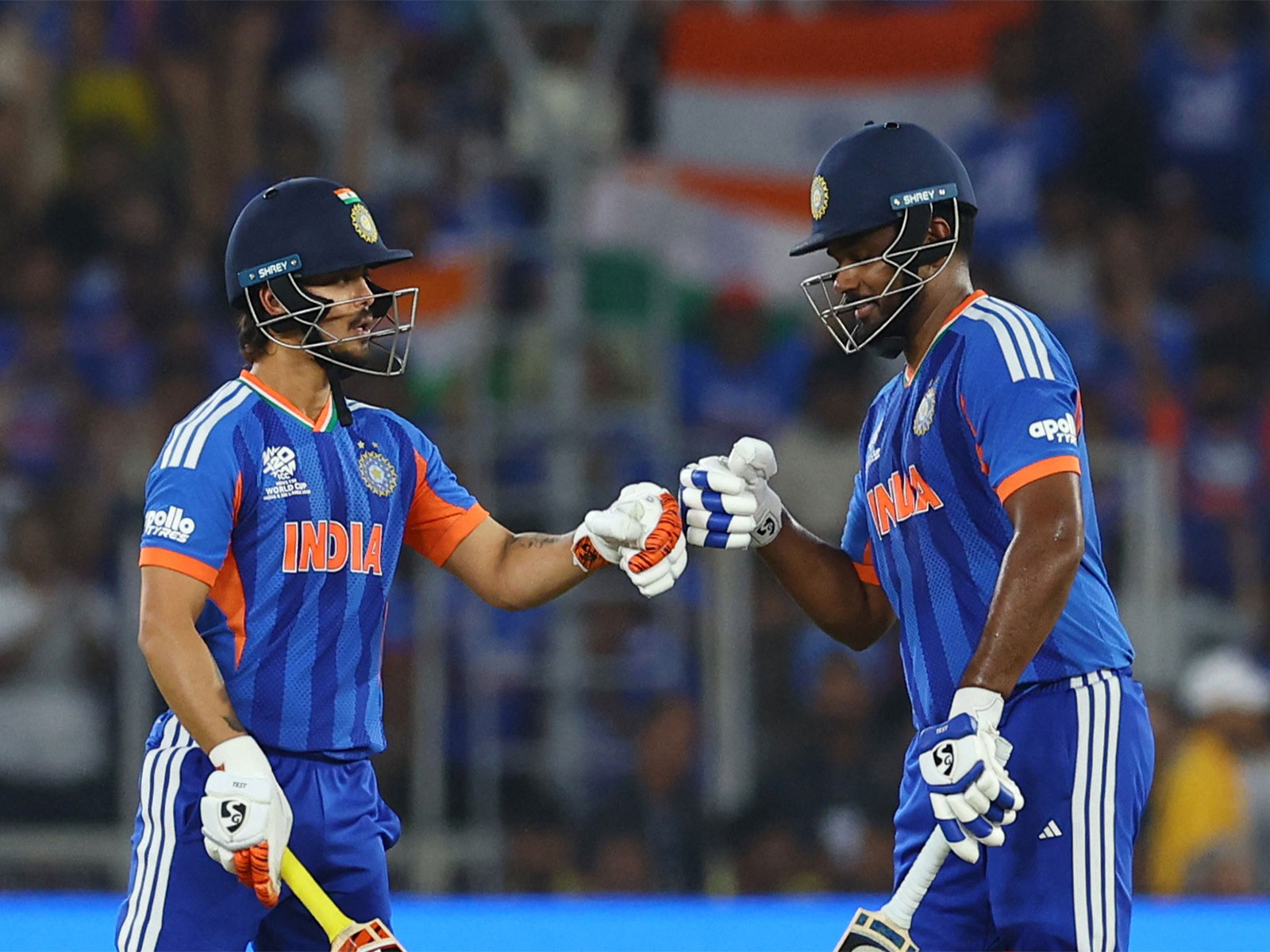 Ishan Kishan bumps fists with Sanju Samson. (Photo/Reuters)