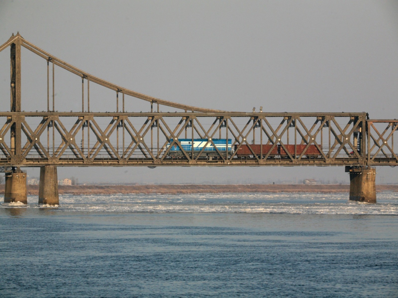 A freight train seen on the Friendship Bridge over the Yalu River which connects the Chinese city of Dandong with Sinuiju in North Korea in January 2010. (Photo/Reuters)