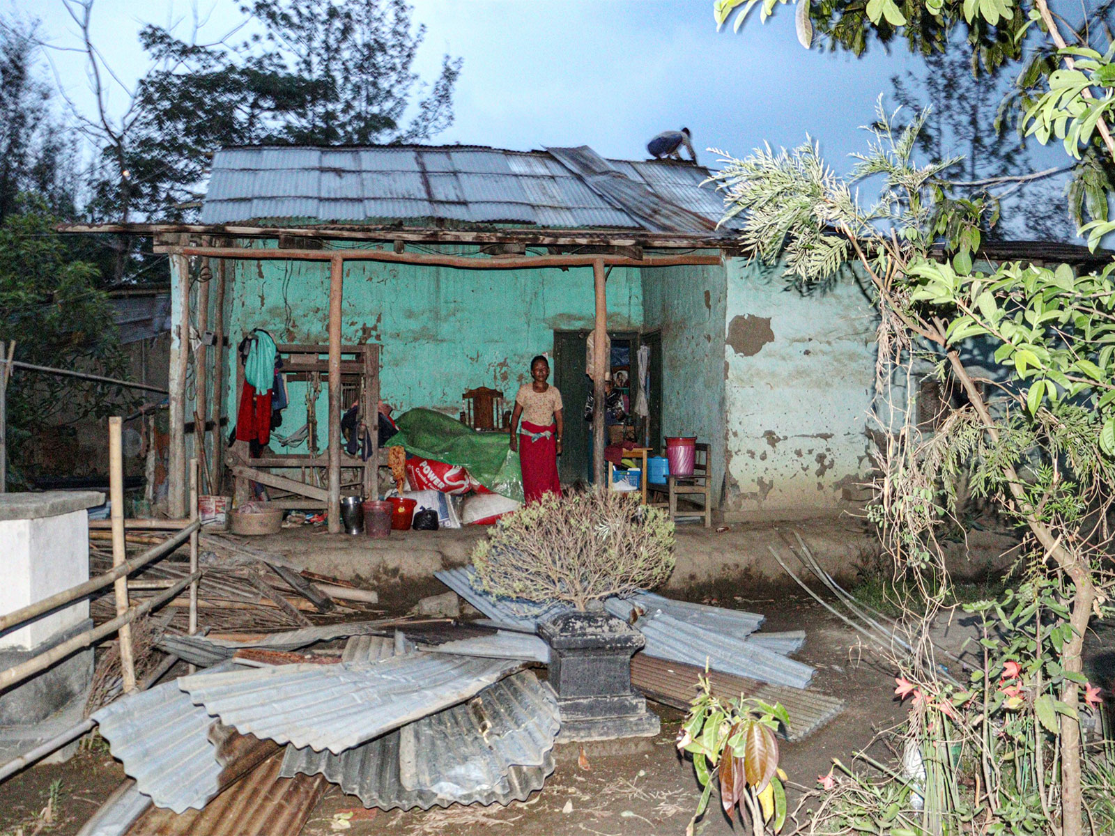 A view of damaged houses following the continuous heavy rain and thunderstorms, in Bishnupur on Sunday. (File Photo/ANI)