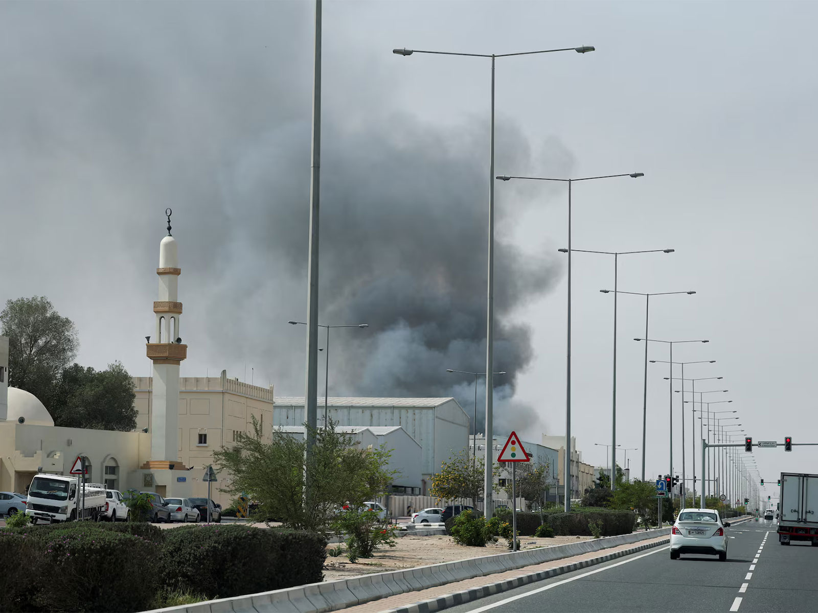 Smoke rises following reported Iranian missile attacks after United States and Israel strikes on Iran, as seen from Doha, Qatar. (Photo/Reuters)