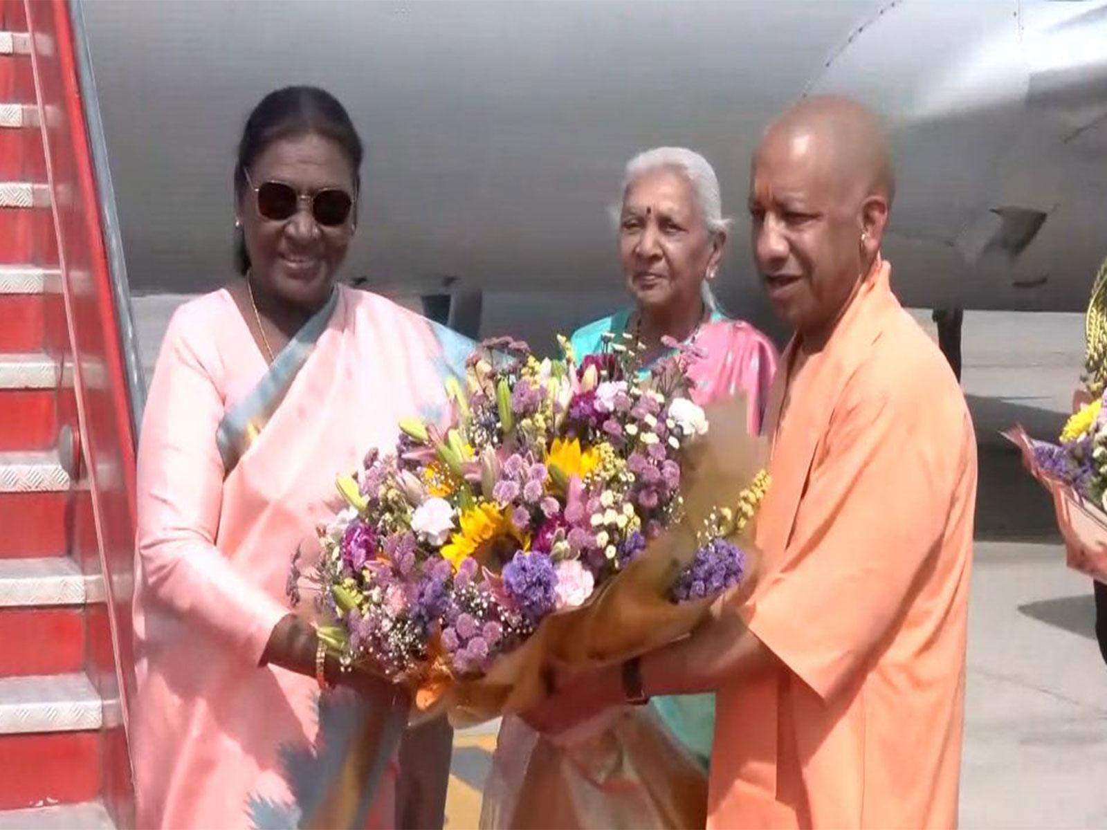 Uttar Pradesh Chief Minister Yogi Adityanath welcomes President  Droupadi Murmu (Photo/ANI)