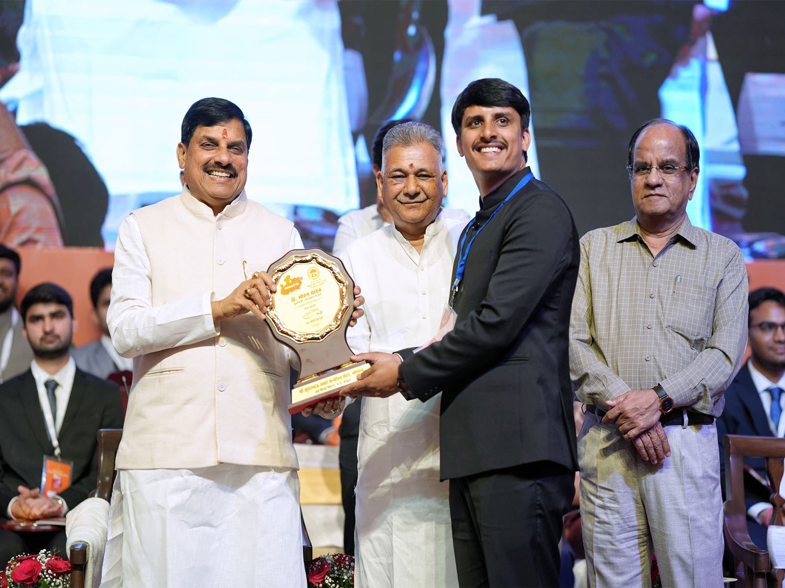 MP CM Mohan Yadav is felicitating the candidate (Photo/ X @DrMohanYadav51)