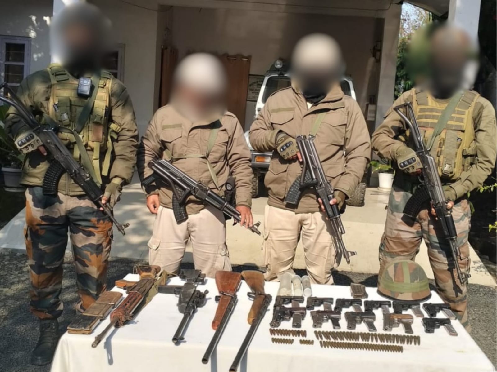 Security forces with recovered arms (Photo/ANI)