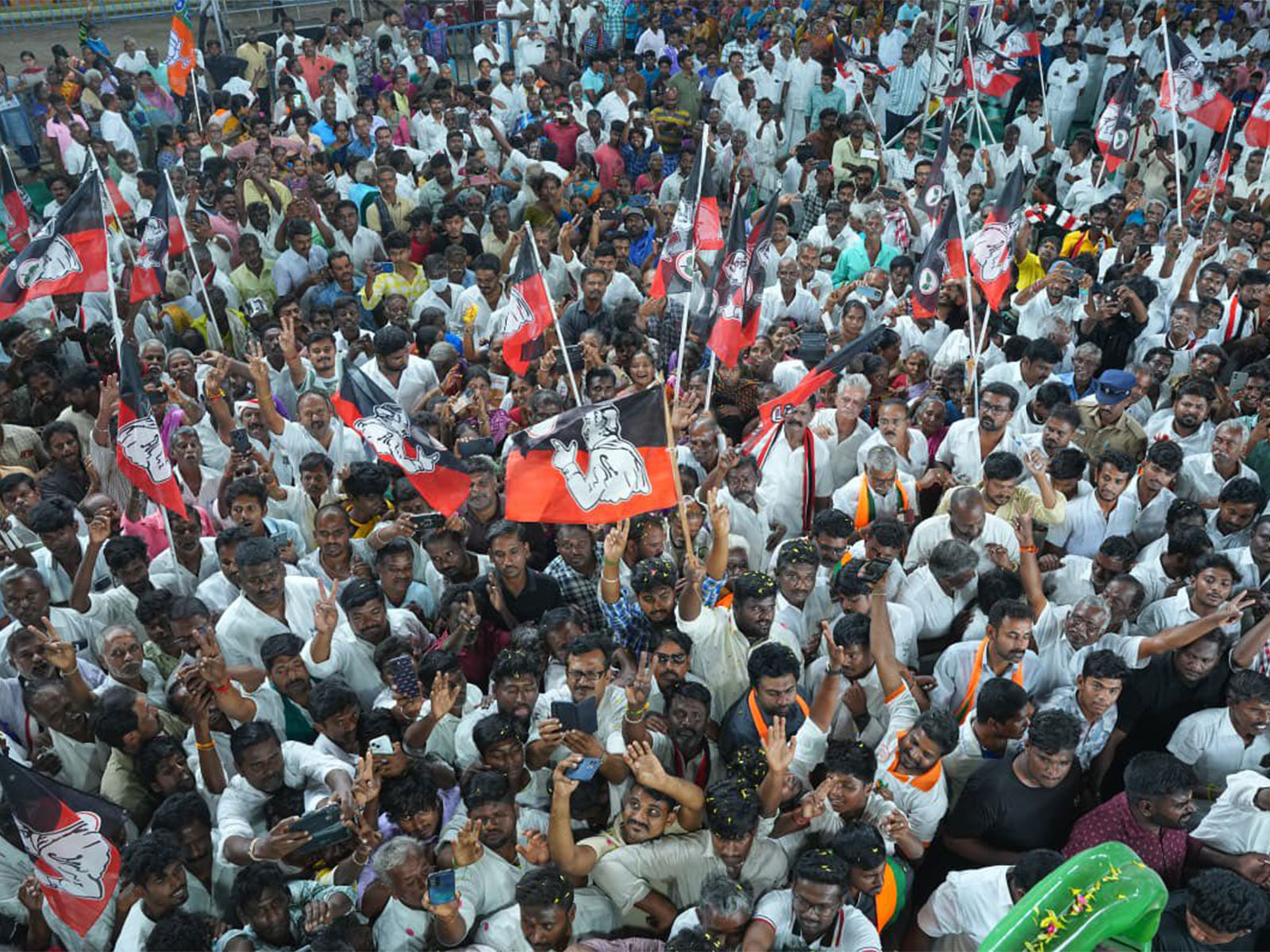 Supporters hold AIADMK flags during an election campaign (Photo/X@EPSTamilNadu)