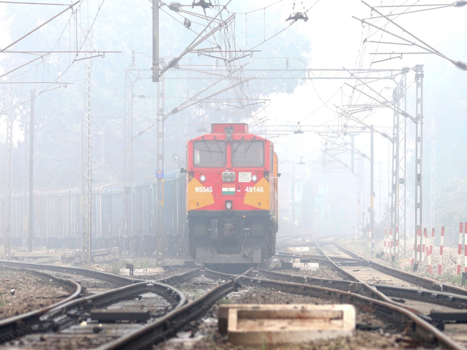 A train passes through dense fog on a cold winter morning, in Lucknow (Photo/ANI)