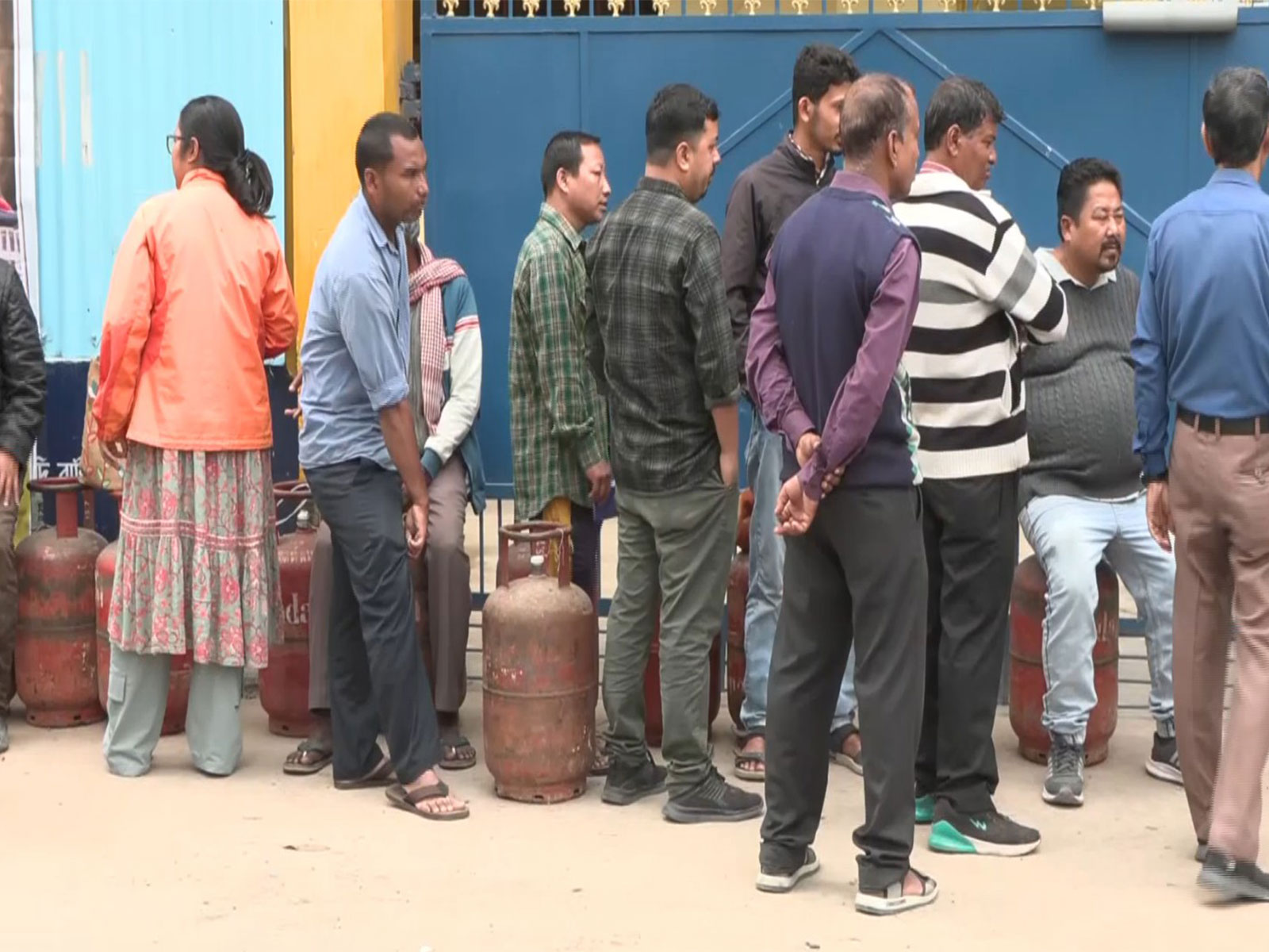 People stand in long queues for LPG cylinders outside Gas Agency in Assam (Photo/ANI)