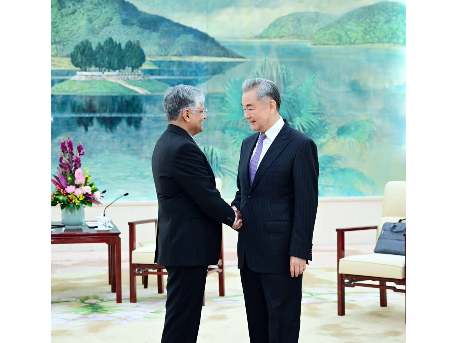 Chinese Foreign Minister Wang Yi with outgoing Indian Ambassador to China Pradeep Kumar Rawat (Photo/X@China_Amb_India)