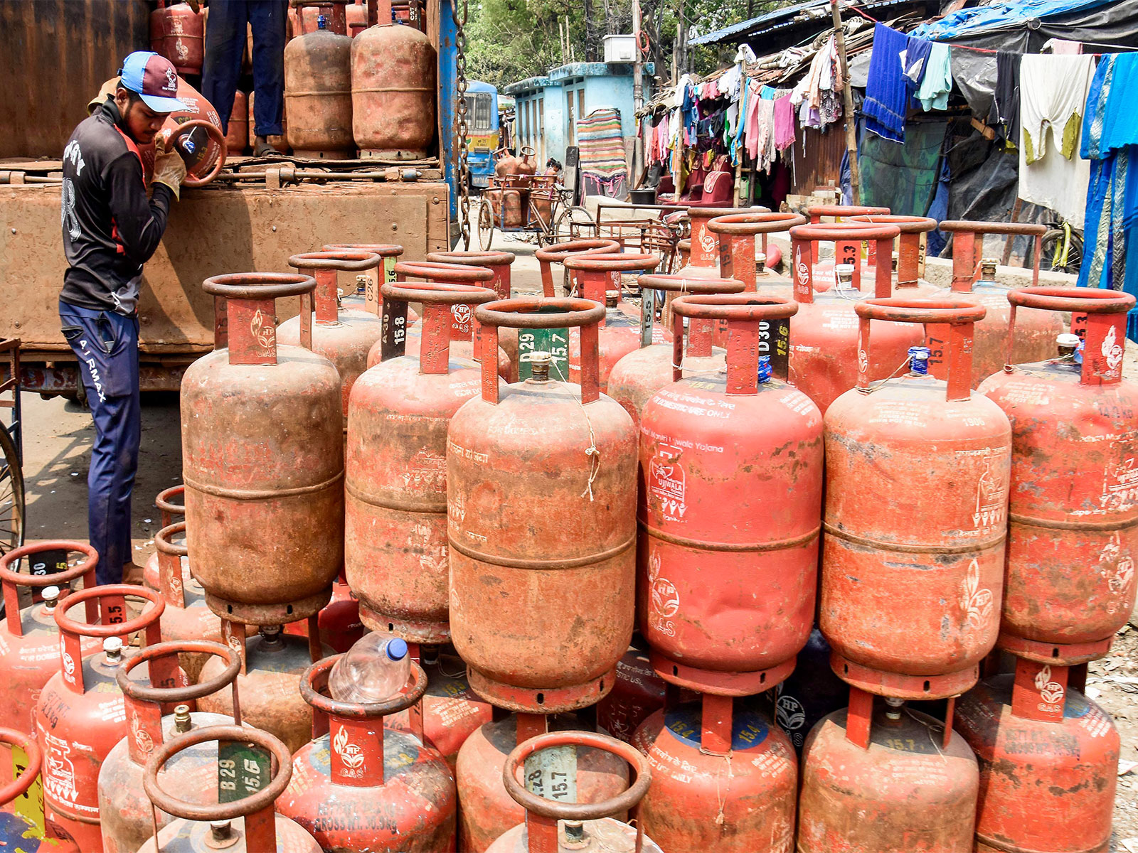 Workers unload LPG cylinder from a truck amid the reported LPG supply shortage (File Photo/ANI)