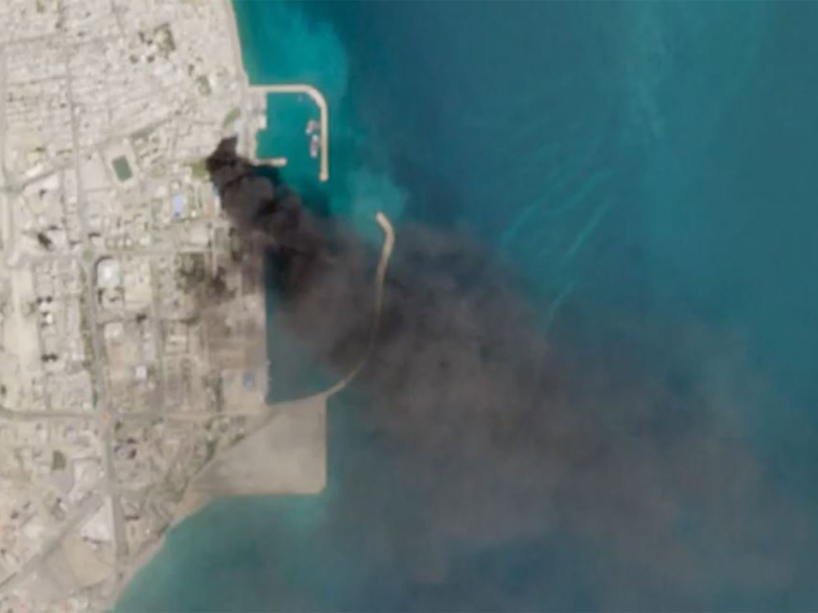 Satellite imagery shows damage, smoke at Iran's Qeshm port after US-Israeli strikes (Photo/Reuters)