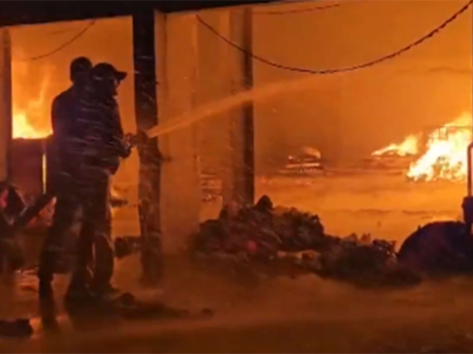 Fire tenders deployed at a textile unit as operations continue. (Photo/ANI)