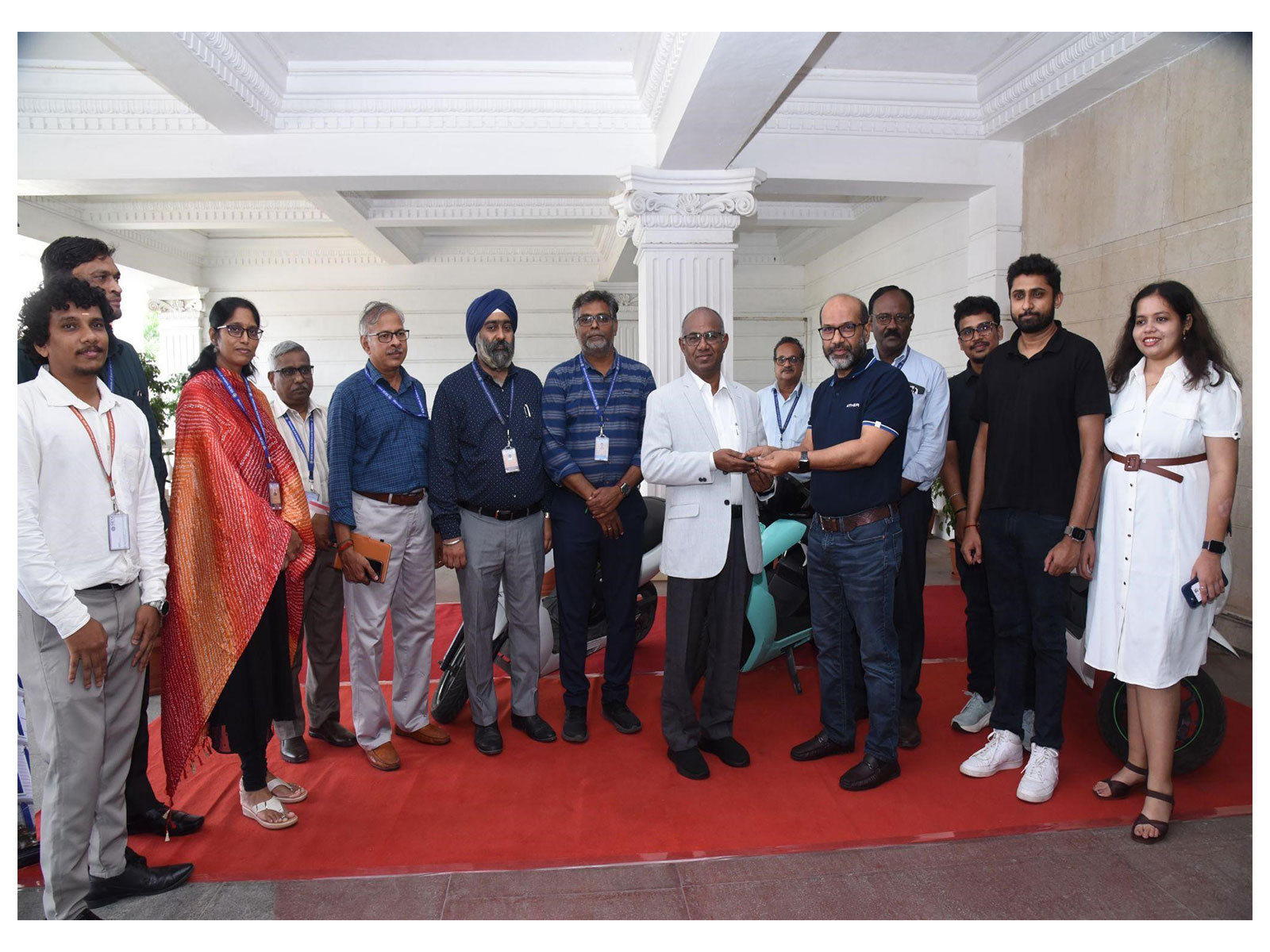 Dignitaries from SRMIST and Ather Energy during the handover of three electric vehicles.
