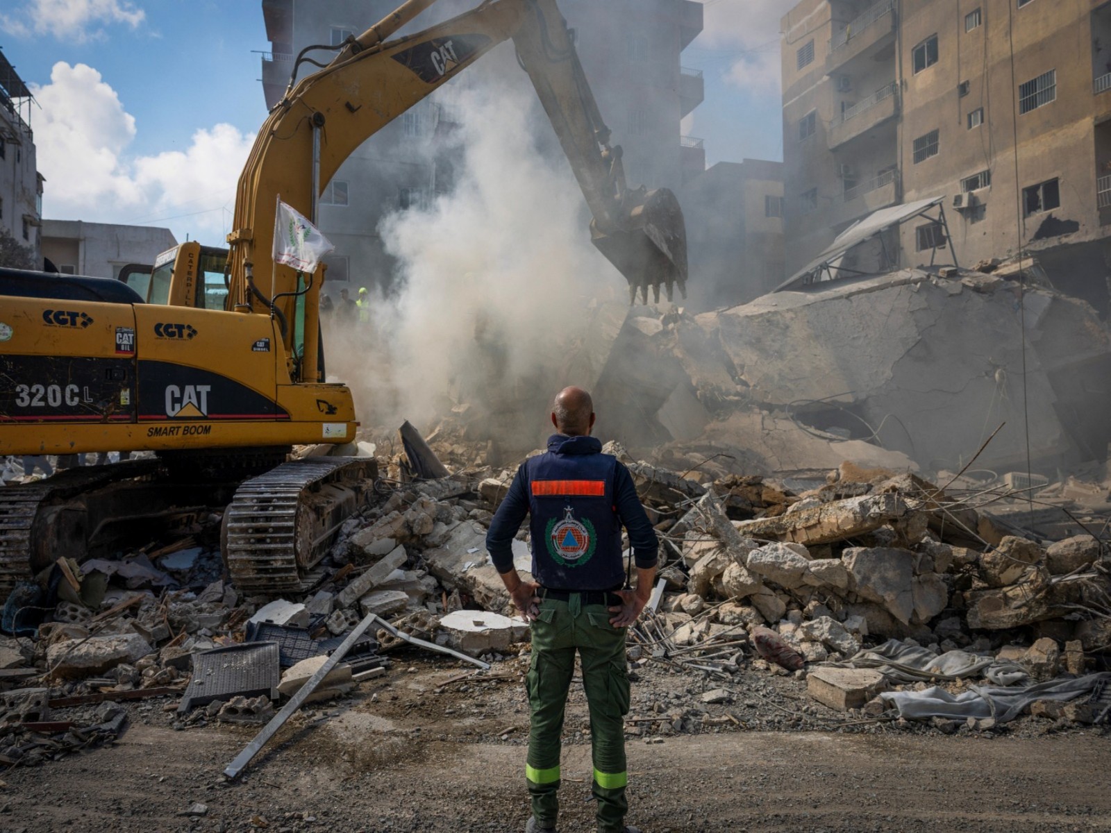 A rescue worker stands next to the rubble at the site of an Israeli strike in Tyre, Lebanon (Photo/Reuters)