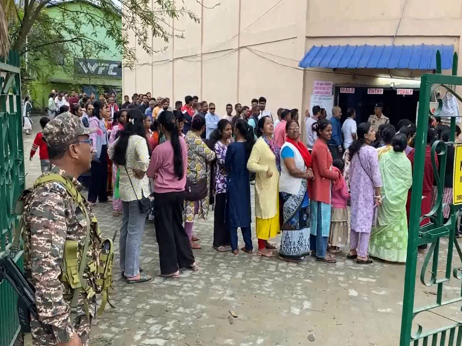 Voters line up at a polling booth in Dibrugarh (Photo/ANI)