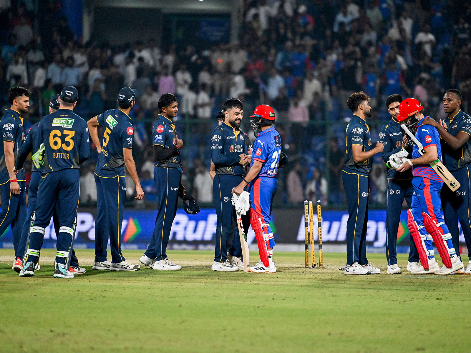 Gujarat Titans players with DC batters. (Photo/ANI)