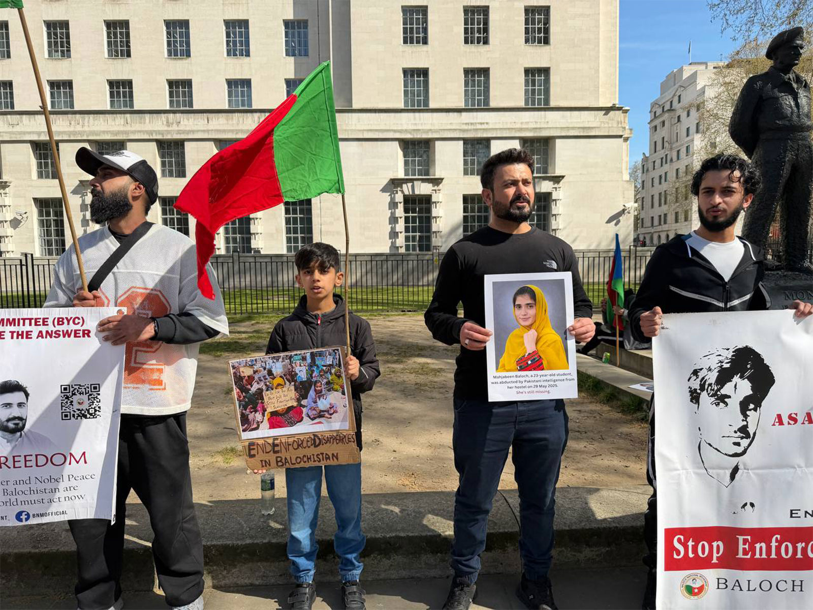 Protesters hold placards and flags during a demonstration highlighting human rights concerns in Balochistan outside 10 Downing Street in London. (Photo: X/@BNM_UK_chapter)
