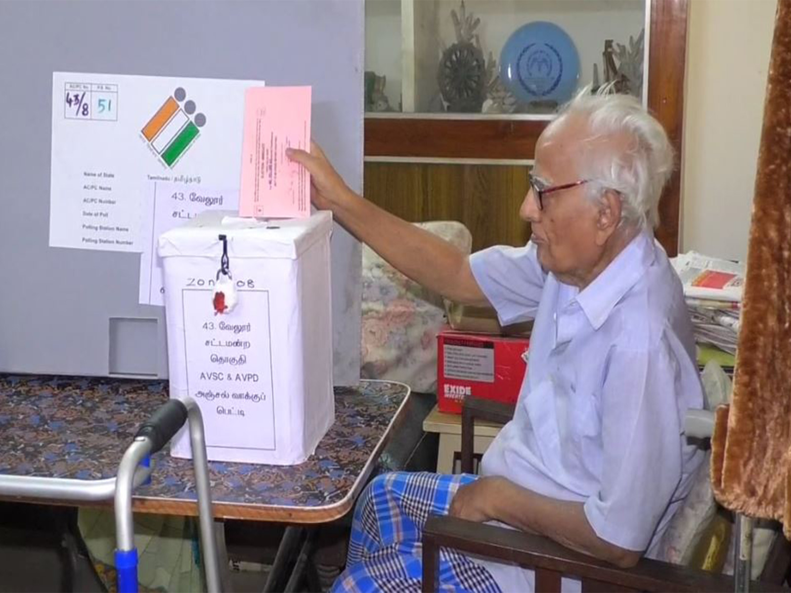 A senior citizen in Tamil Nadu casting his vote from home via a postal ballot box (Photo/ANI)